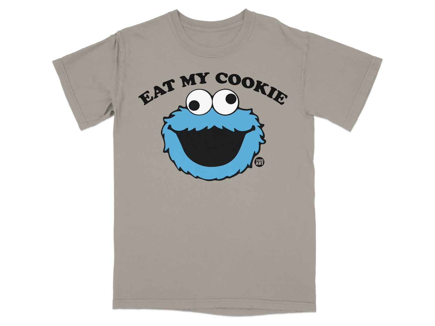 Tan t-shirt with Cookie Monster graphic and "EAT MY COOKIE" text.
