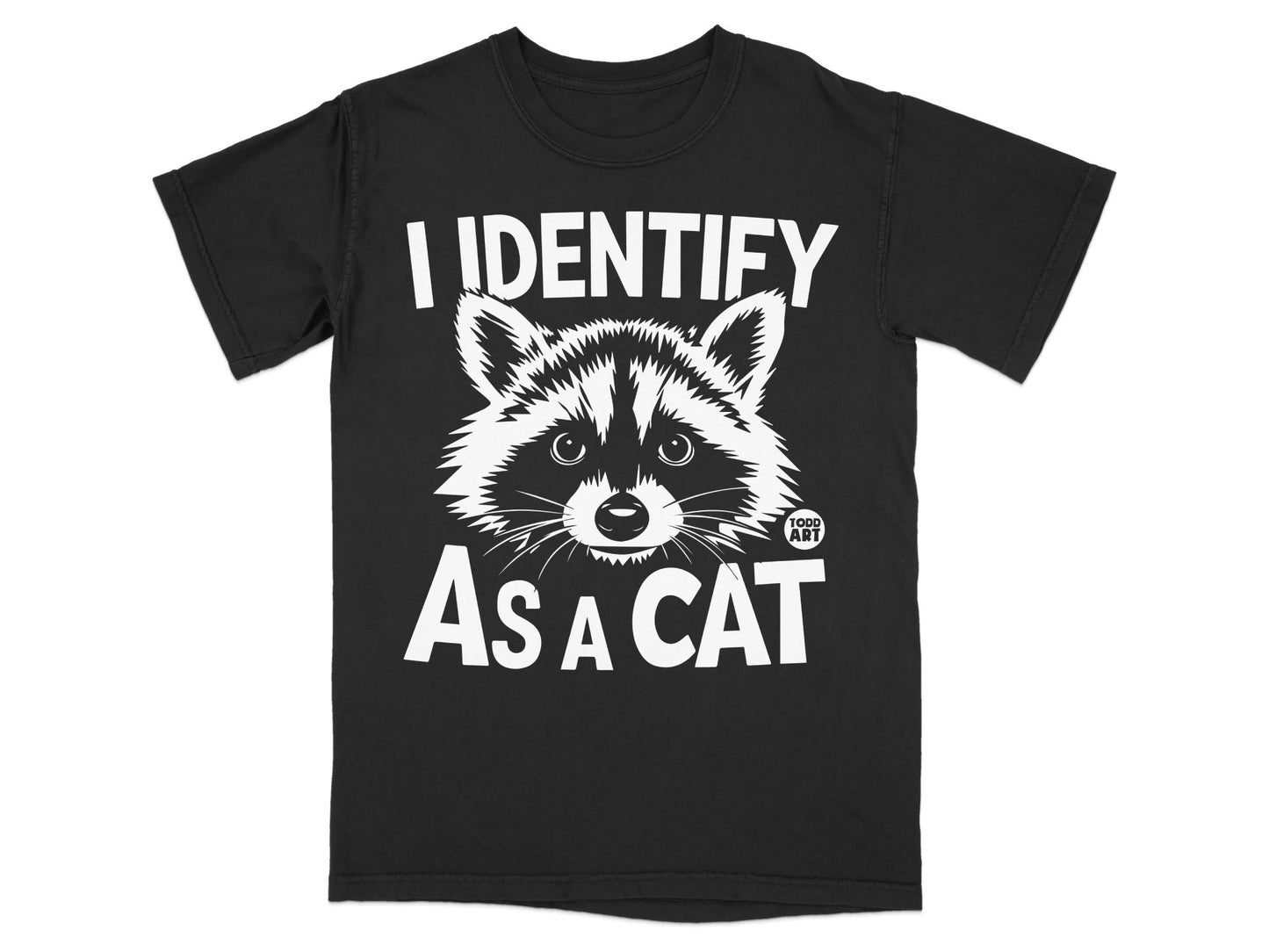 Black t-shirt with white text "I IDENTIFY AS A CAT" and raccoon graphic.