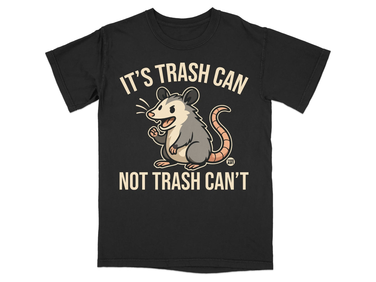 Black t-shirt with a cartoon possum and text "IT'S TRASH CAN NOT TRASH CAN'T".