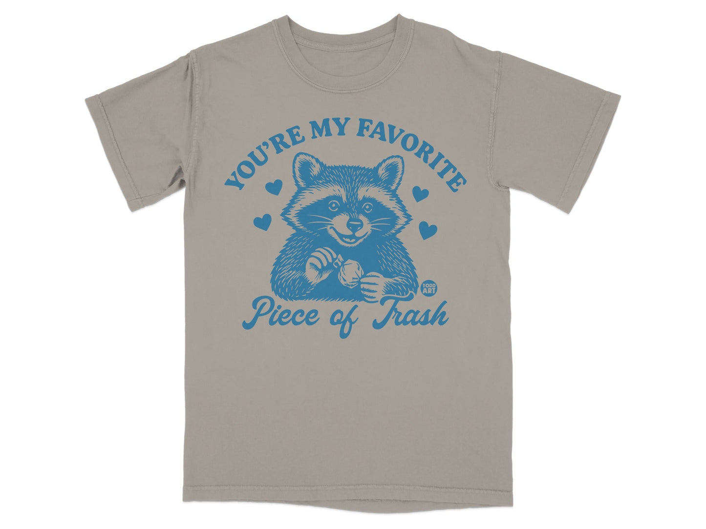 T-shirt with blue raccoon graphic and "You're my favorite piece of trash" text.