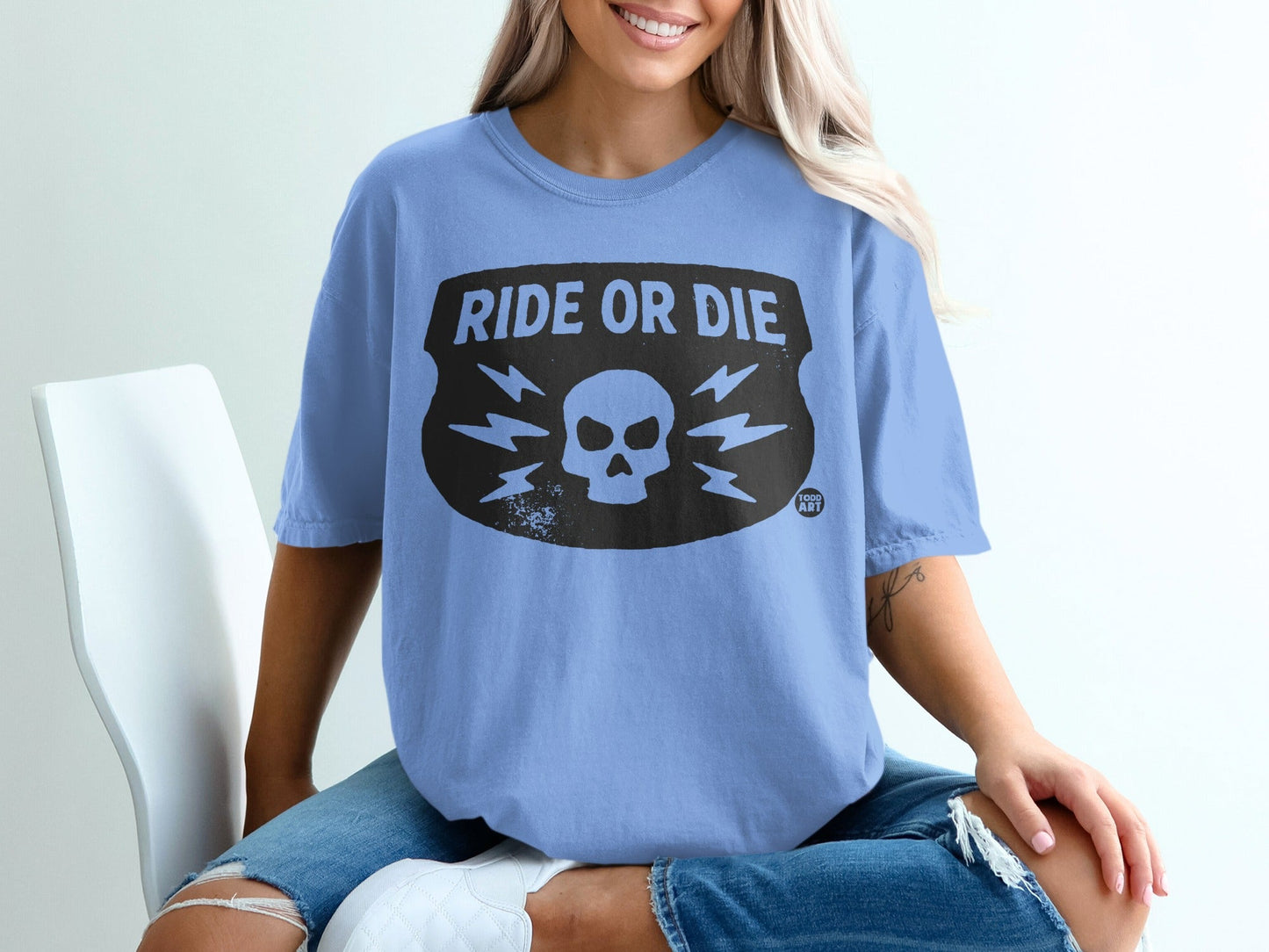 Light blue t-shirt with "Ride or Die" skull graphic on the chest.