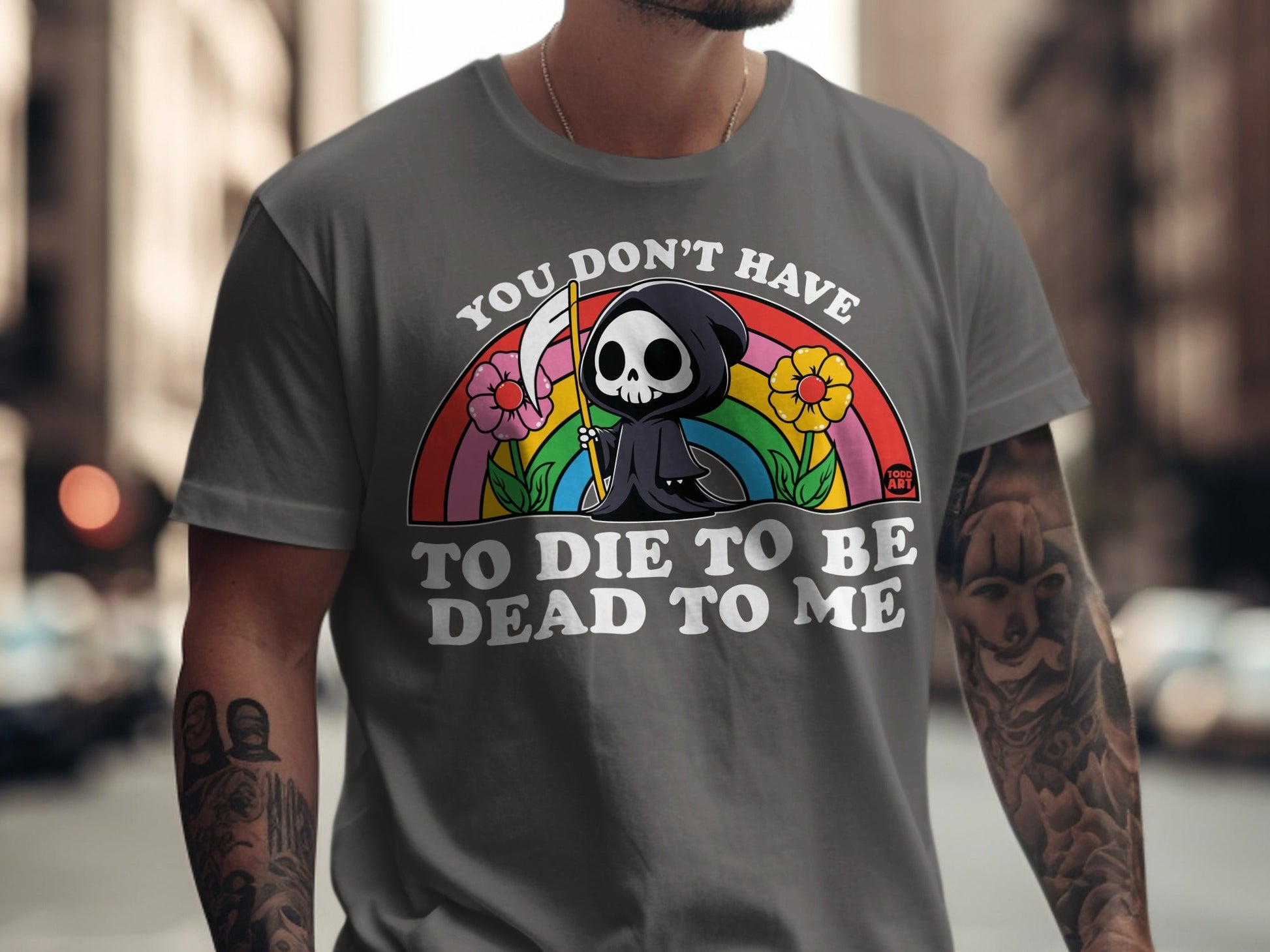 Grey t-shirt with Grim Reaper, rainbow, flowers, and text.