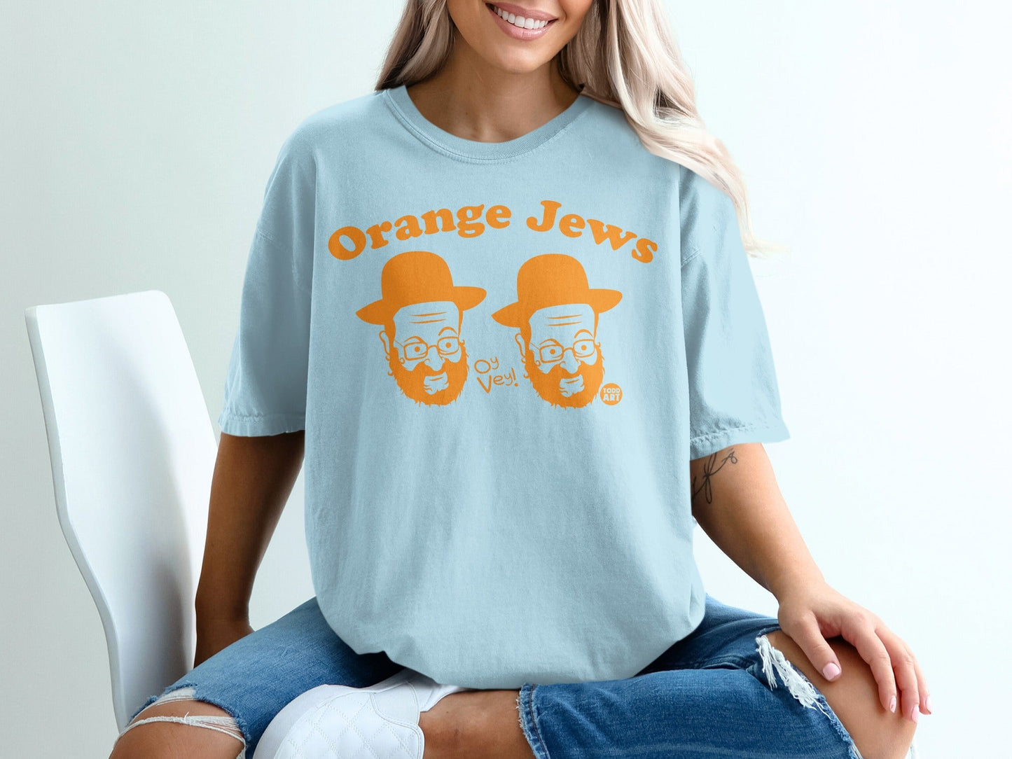 Light blue t-shirt with "Orange Jews" and cartoon faces saying "Oy Vey!"