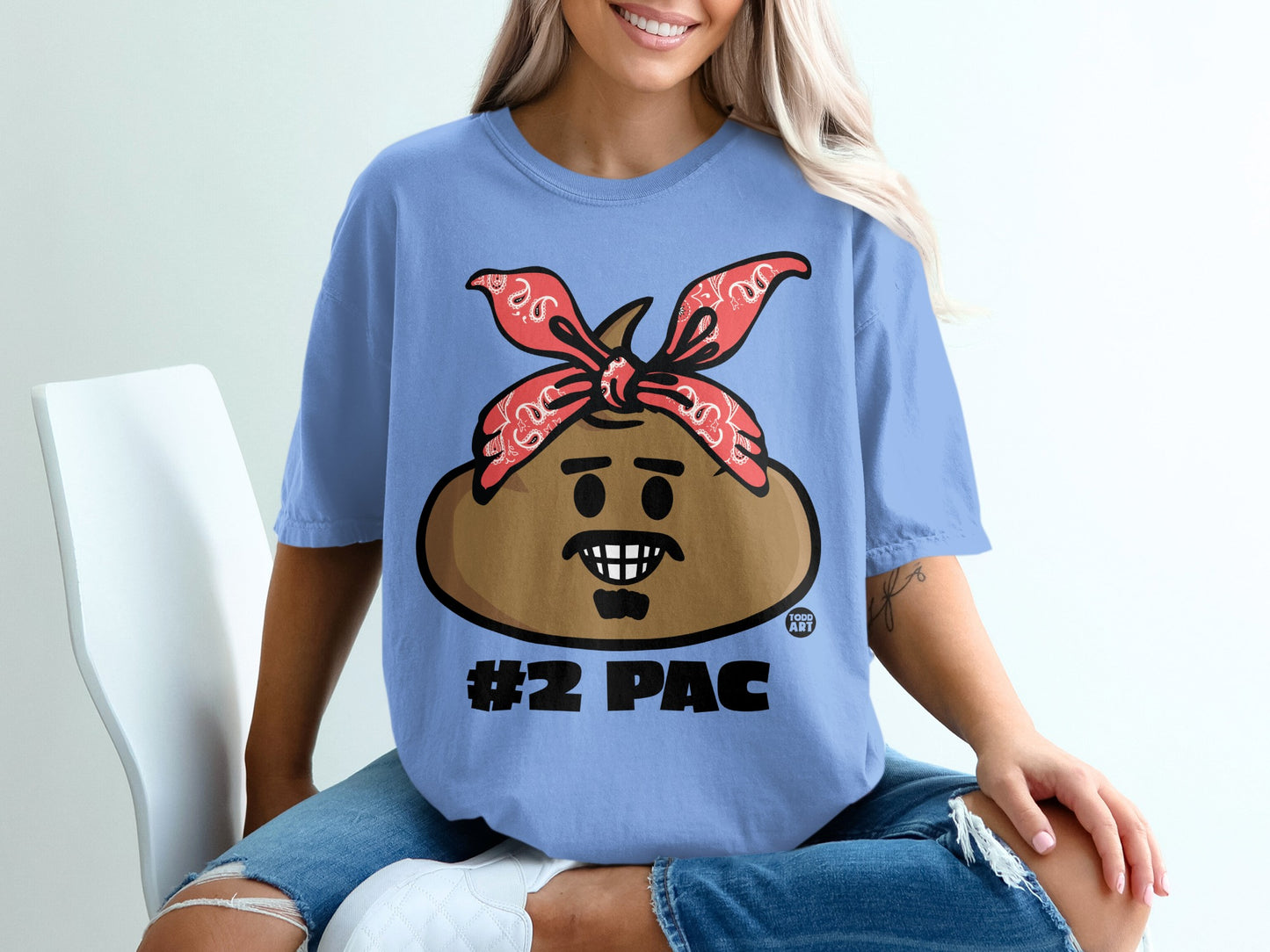 Blue t-shirt with cartoon face wearing a red bandana, labeled "#2 Pac".