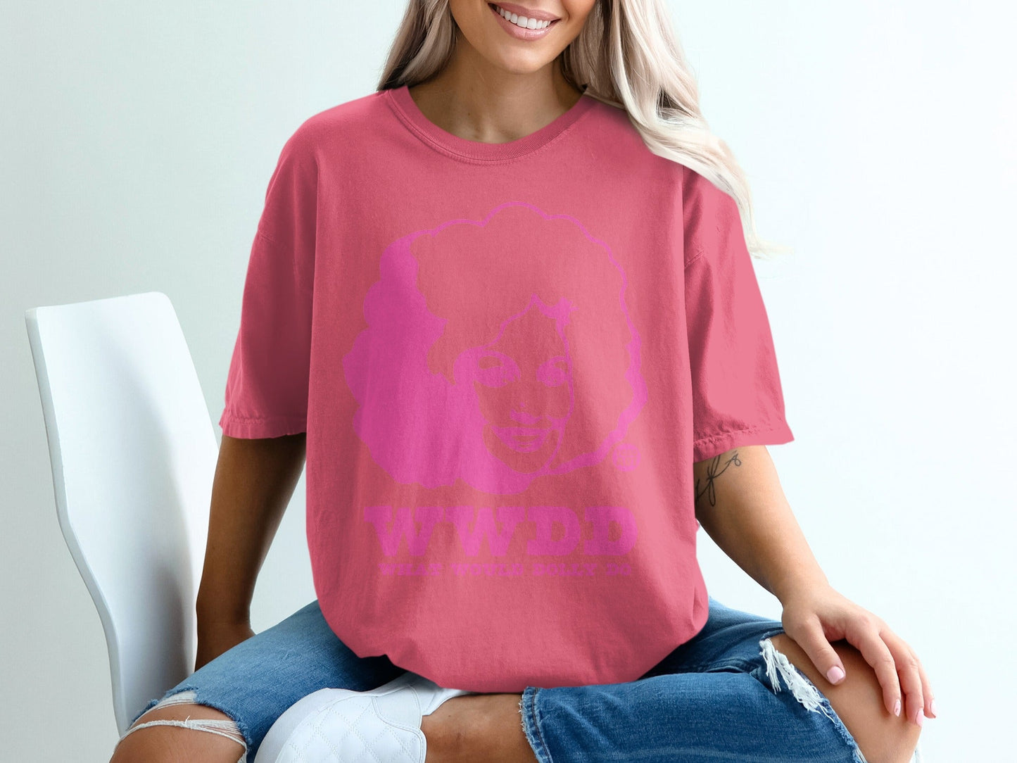 Pink t-shirt with Dolly Parton graphic and "WWDD" text.