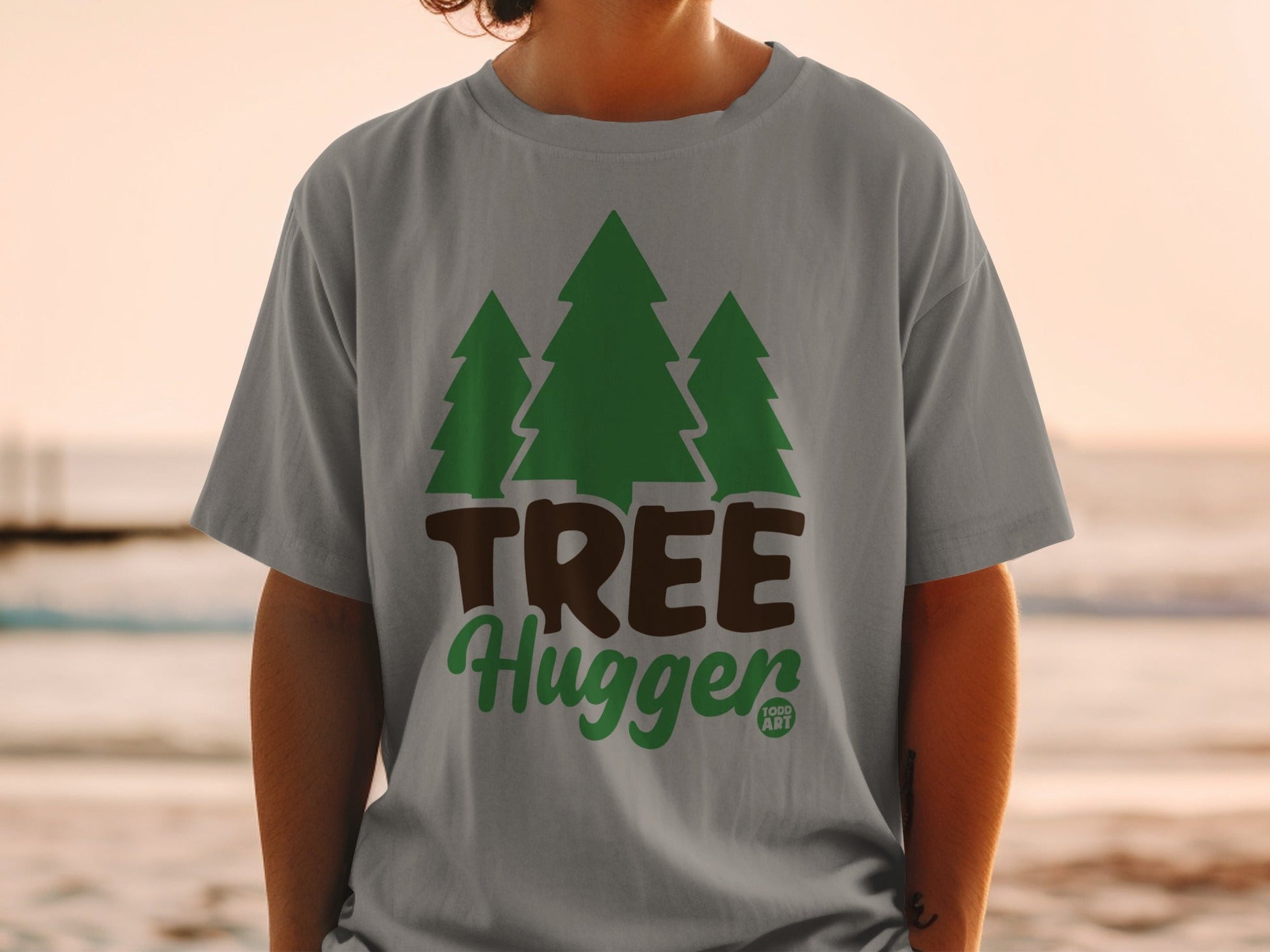Grey t-shirt with green trees and "TREE Hugger" text.