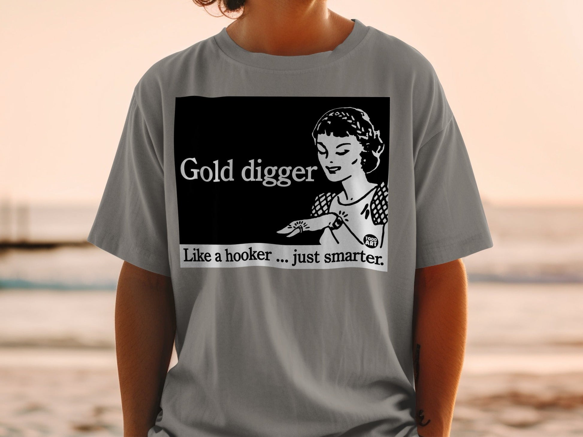 Black t-shirt with "Gold digger, Like a hooker... just smarter." text and vintage woman graphic.