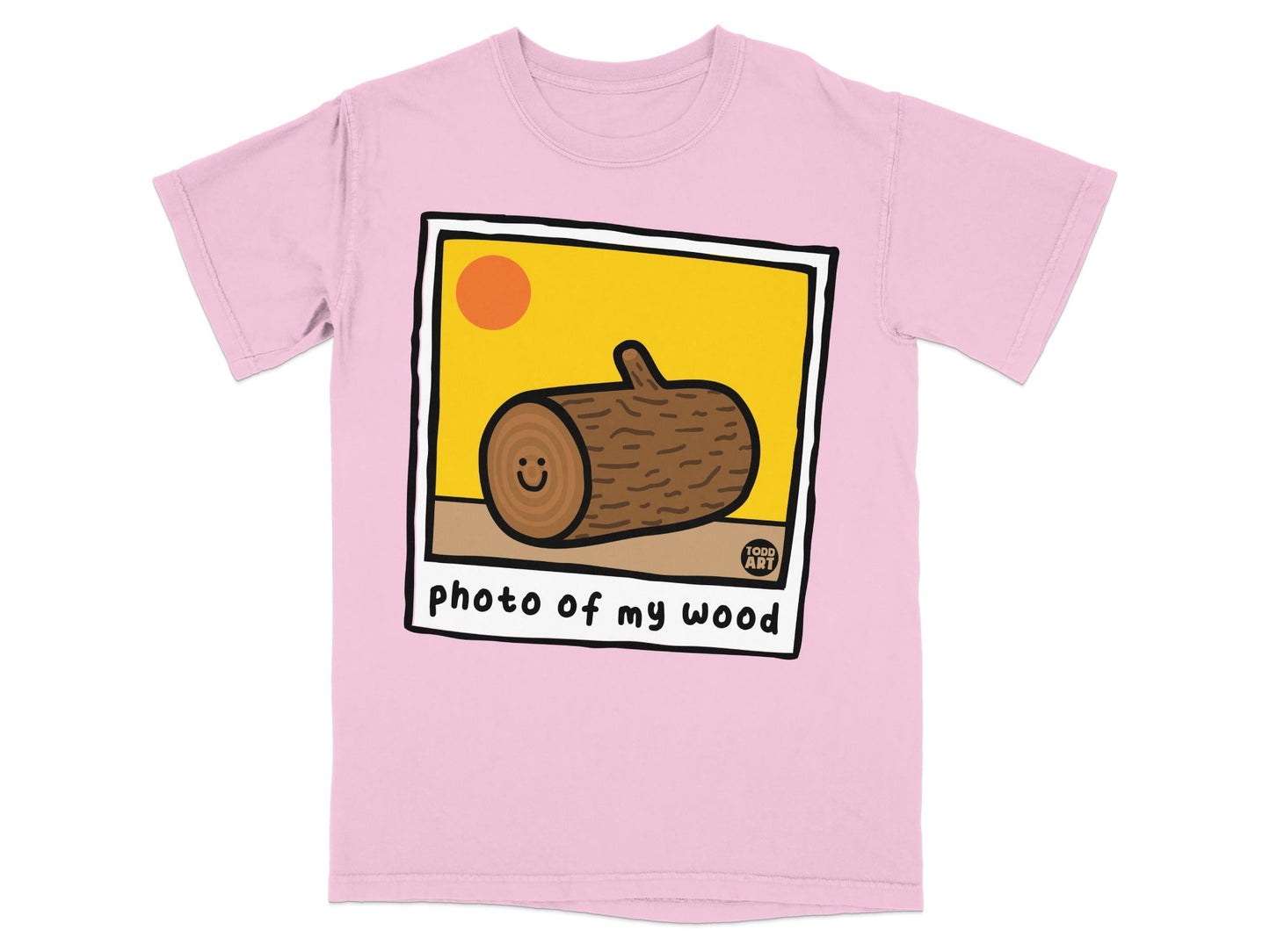 Pink t-shirt with a framed cartoon of a happy log with "photo of my wood" text.