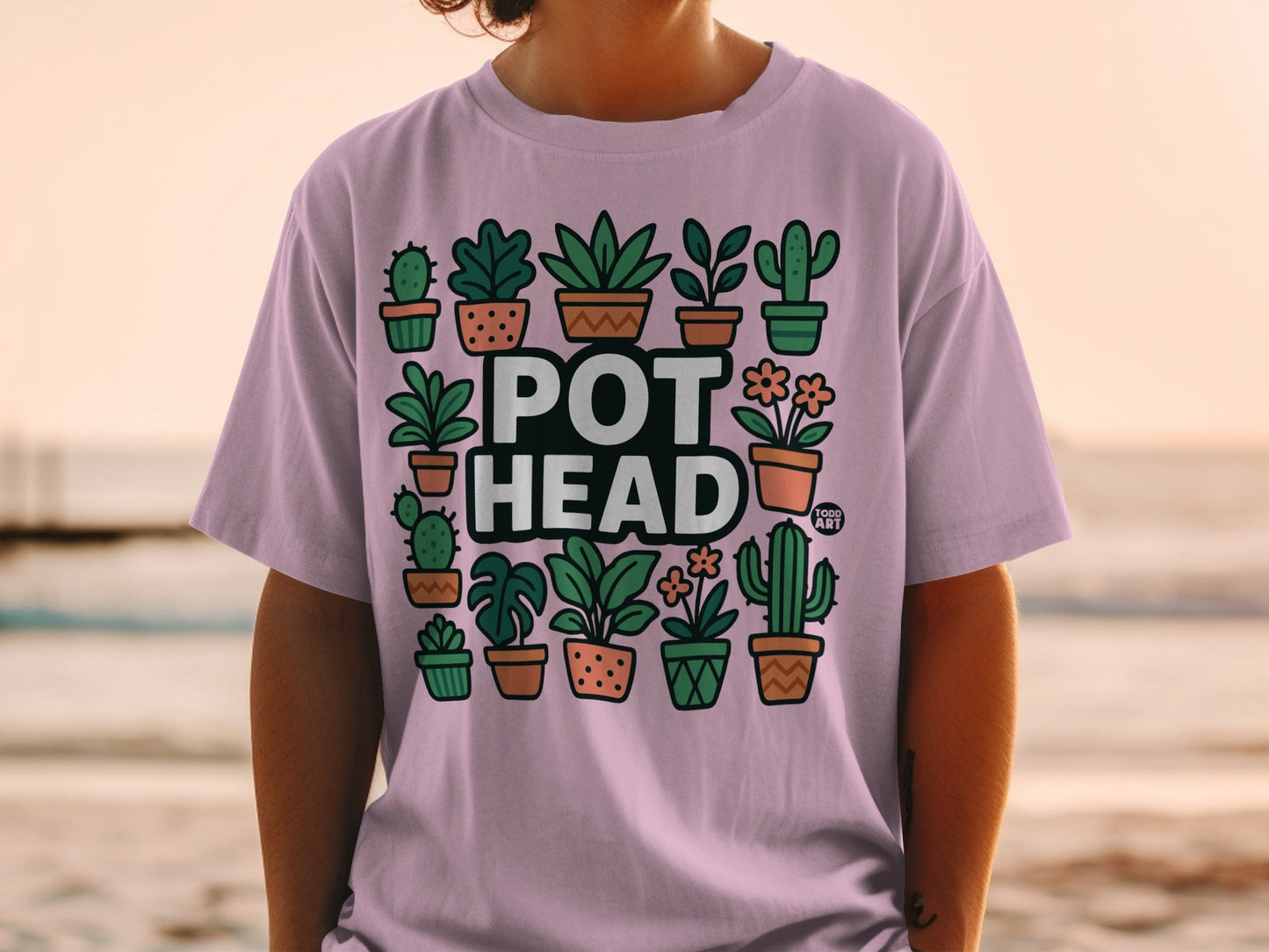 Pink t-shirt with "POT HEAD" and potted plants design.
