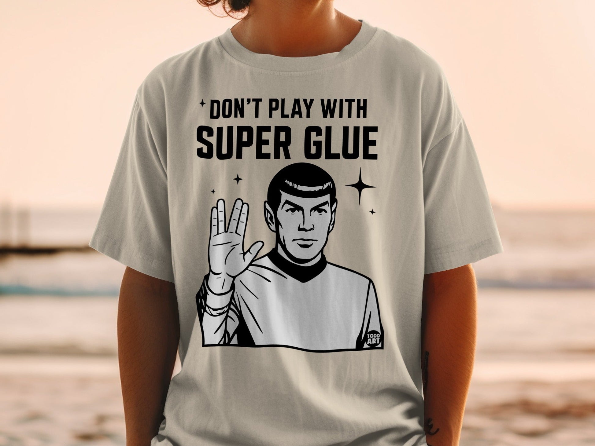 T-shirt with "Don't Play With Super Glue" and Spock giving the Vulcan salute.