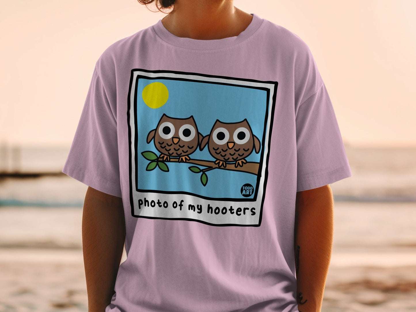 Two cartoon owls on a branch under a sun, text "photo of my hooters".