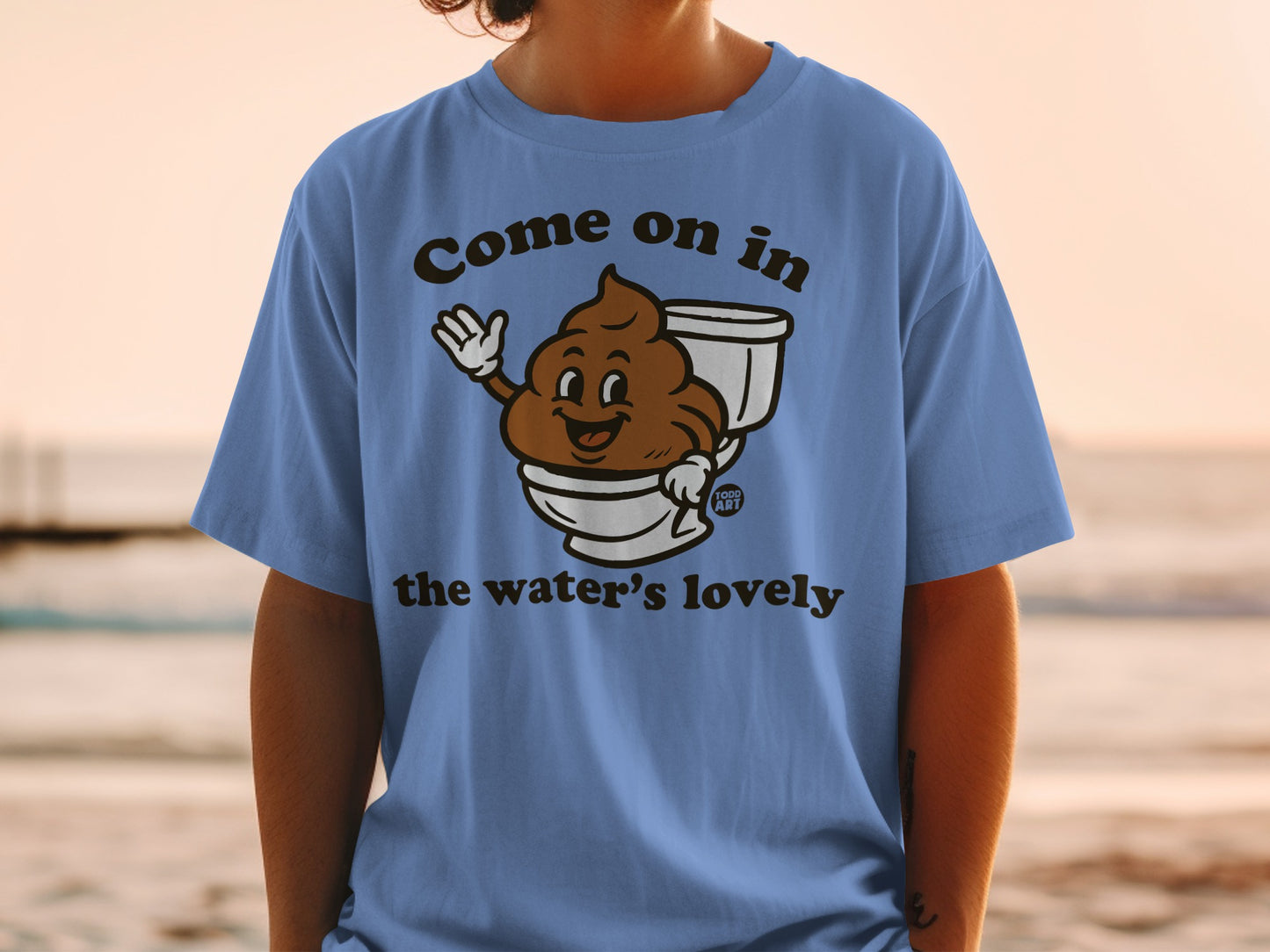 Blue t-shirt with a smiling cartoon poop character in a toilet, saying "Come on in the water's lovely".