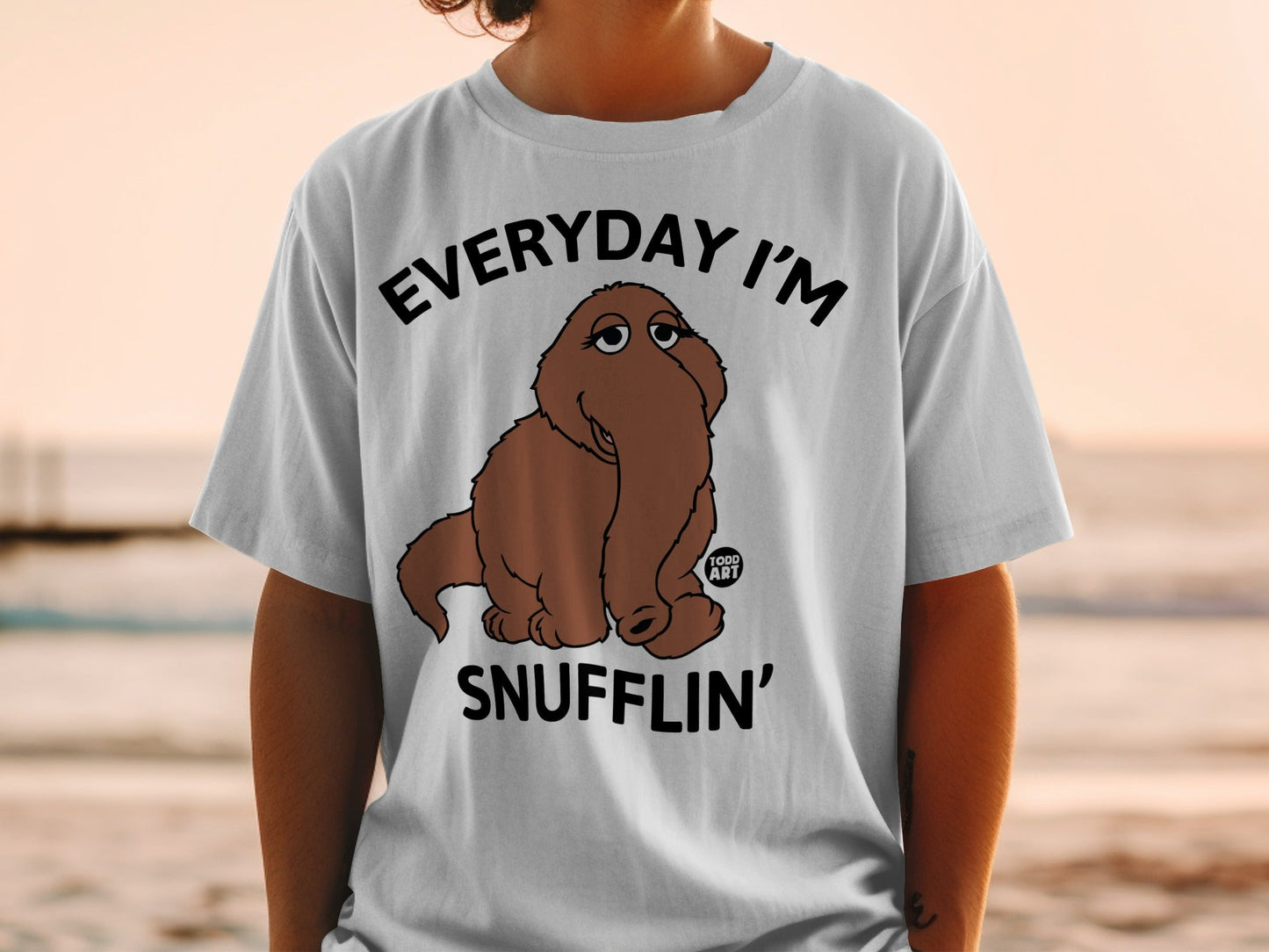 Grey t-shirt with a cartoon character and "EVERYDAY I'M SNUFFLIN'" text.