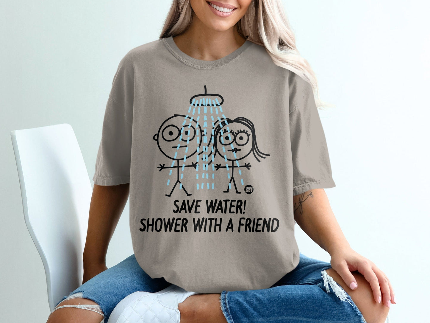 T-shirt with cartoon people showering under the words "SAVE WATER! SHOWER WITH A FRIEND!".