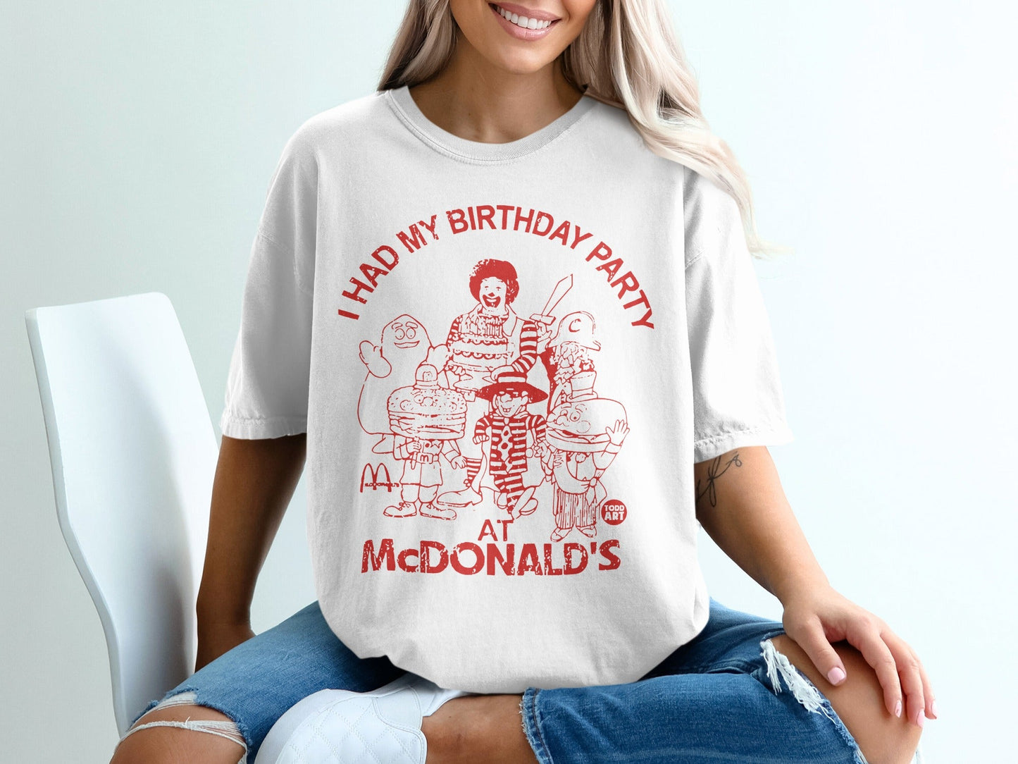 T-shirt with red cartoon characters and text "I HAD MY BIRTHDAY PARTY AT MCDONALD'S".