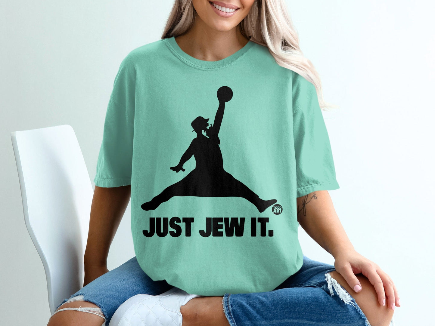 T-shirt with black silhouette of a person dunking a basketball, text "JUST JEW IT."