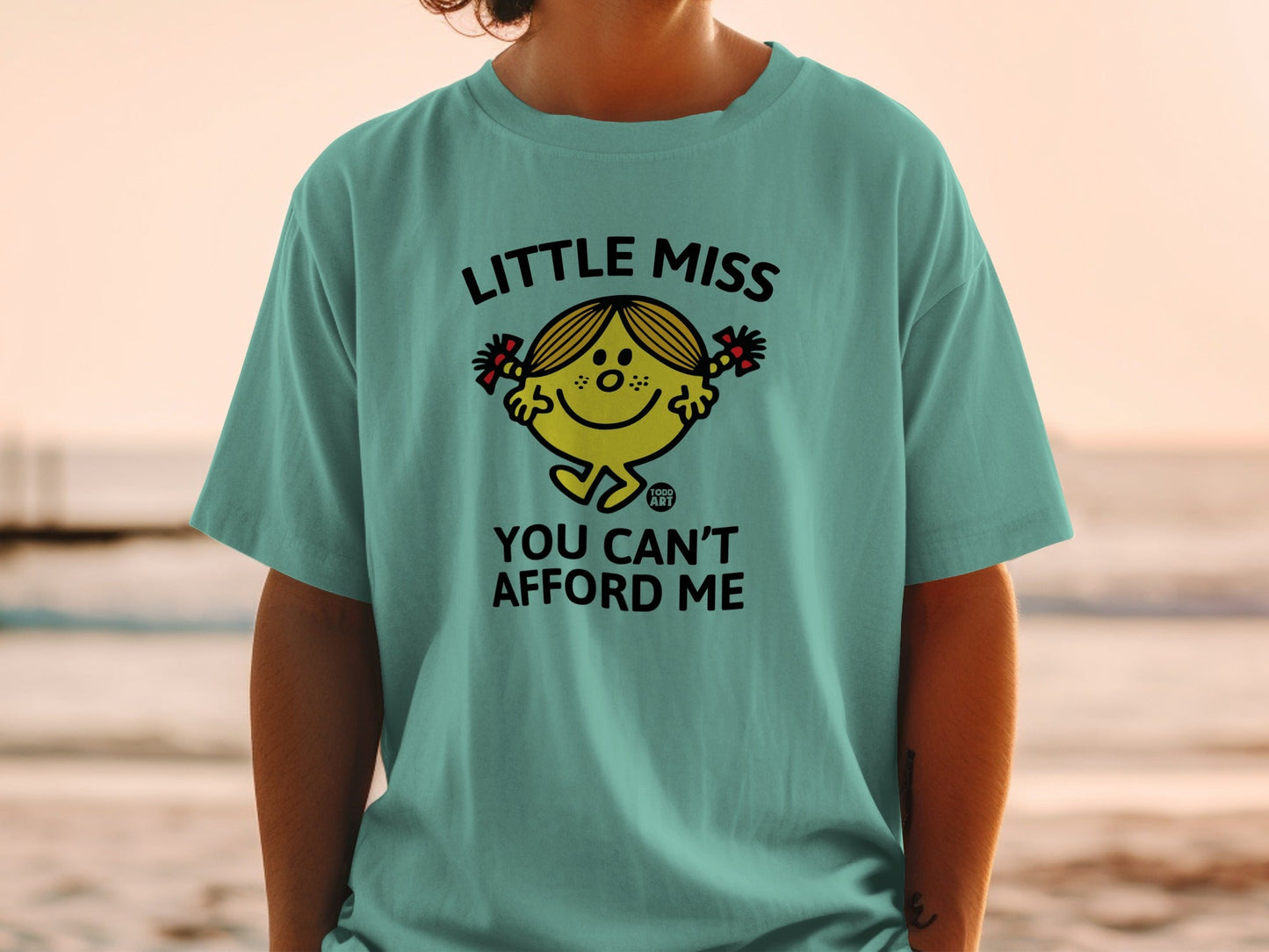 Teal t-shirt with Little Miss character and text "YOU CAN'T AFFORD ME".