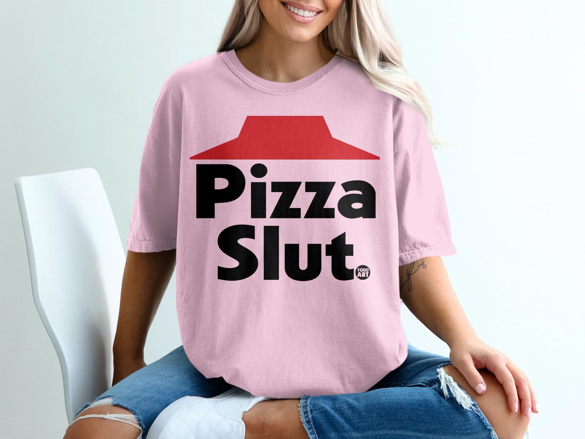Pink t-shirt with "Pizza Slut" and a red pizza box lid design.