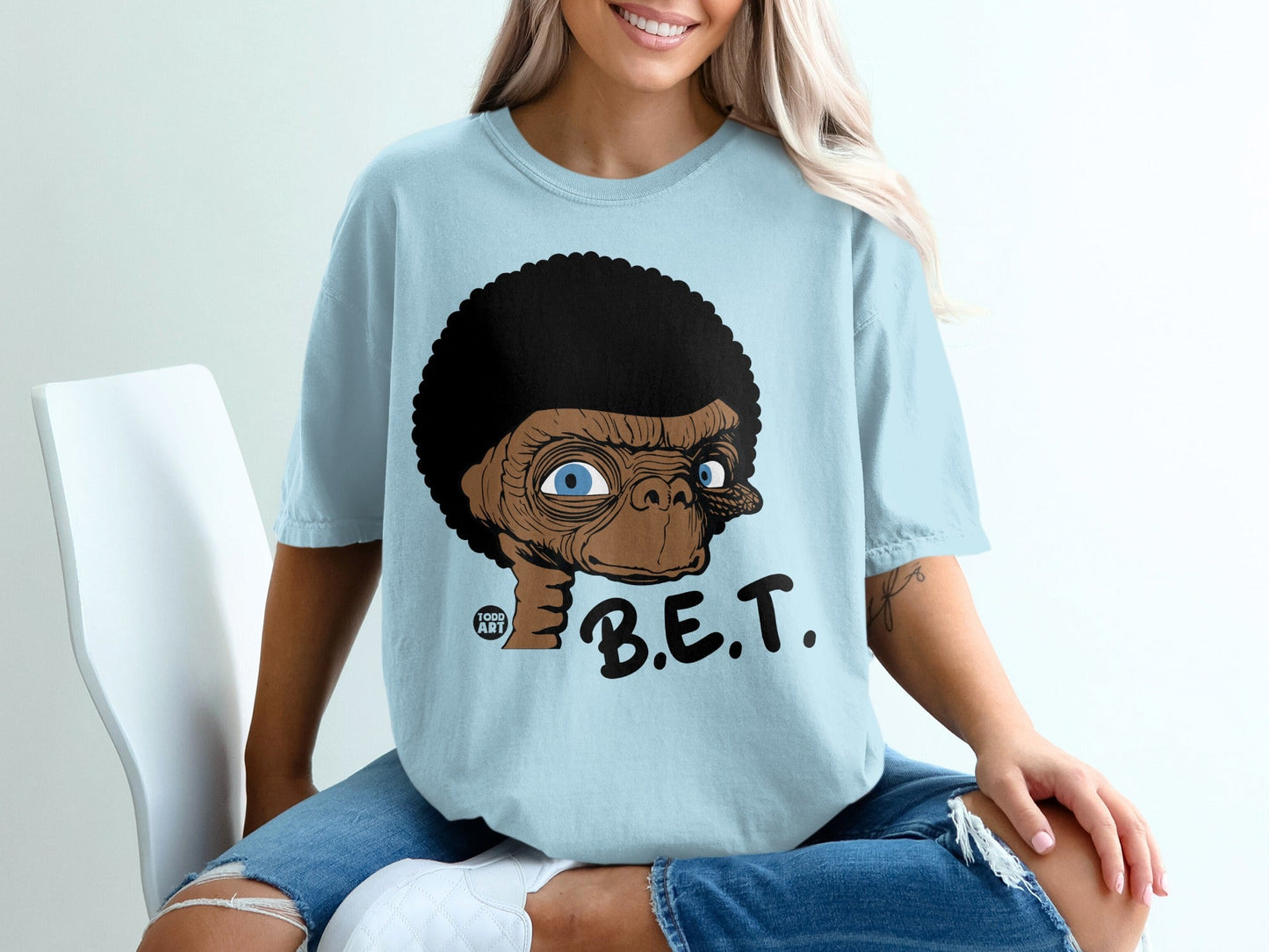 Light blue t-shirt with E.T. and B.E.T. graphic.