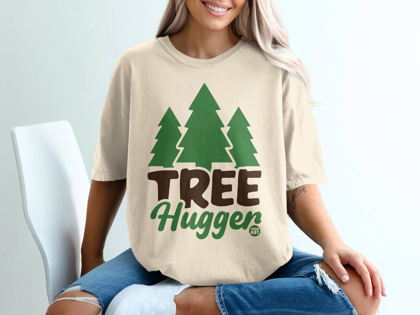 T-shirt with green trees and "TREE Hugger" text.