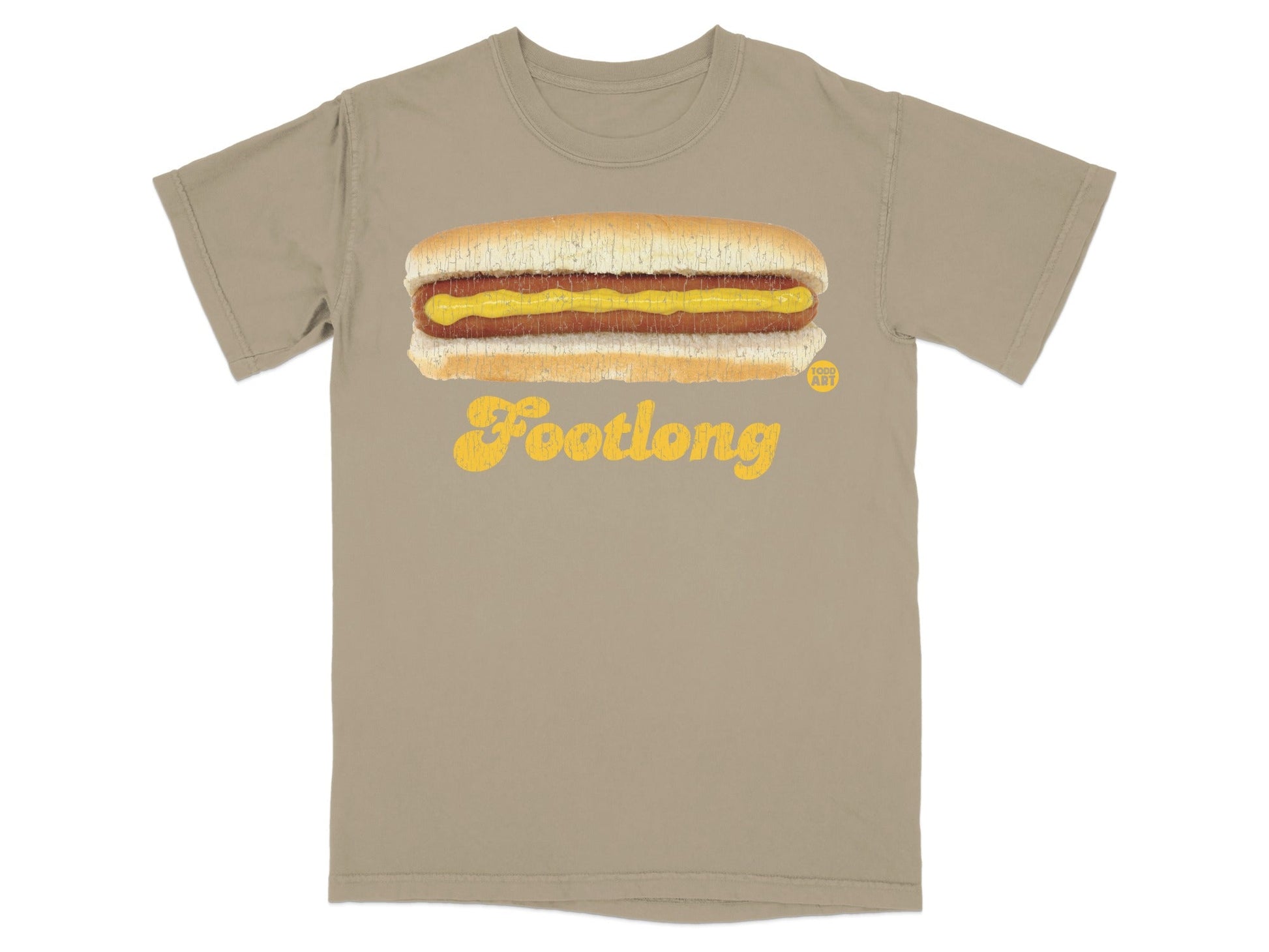 Tan t-shirt with a graphic of a footlong hot dog with mustard.