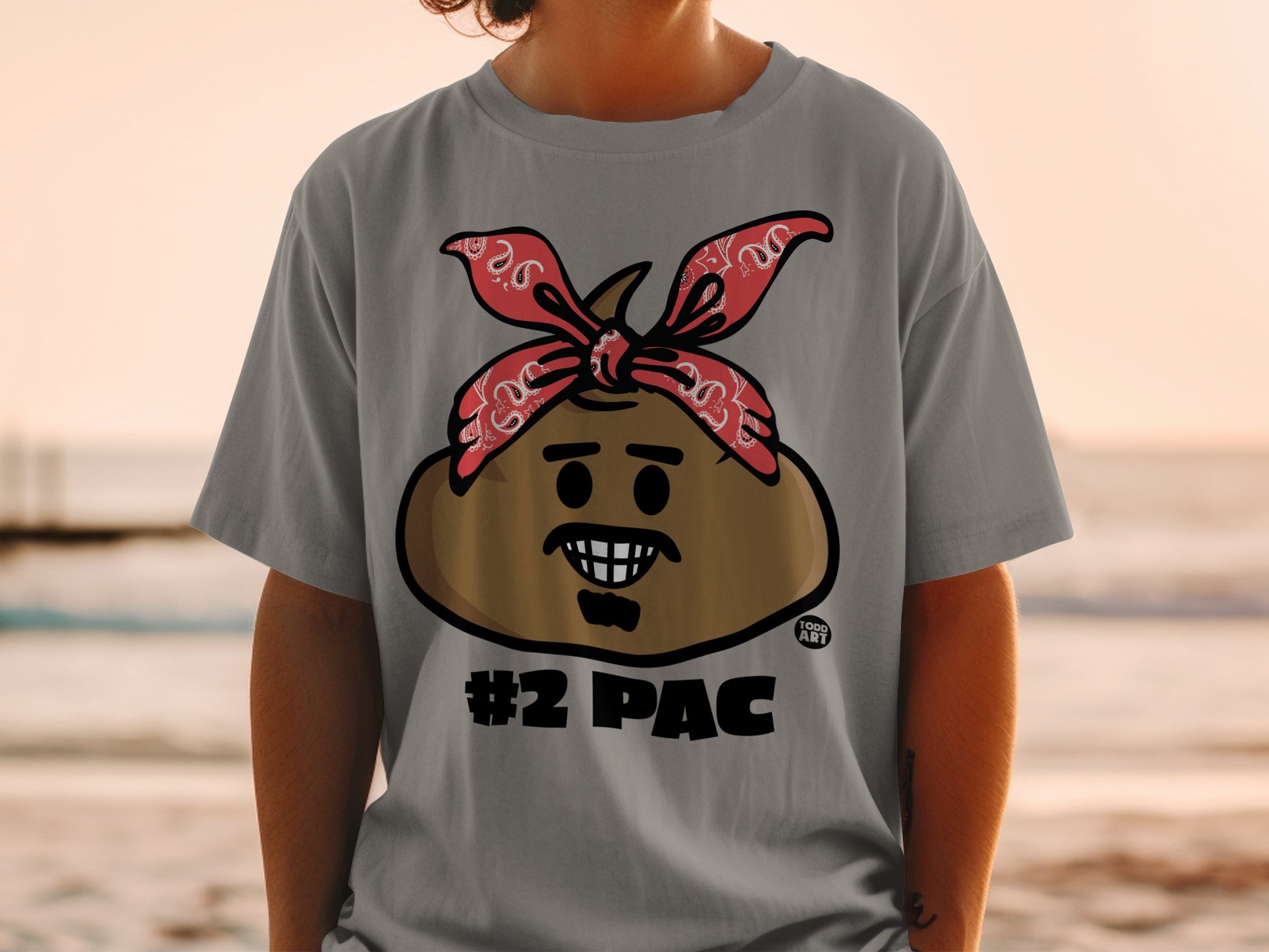 Cartoon character with bandana and #2 PAC text on a grey t-shirt.