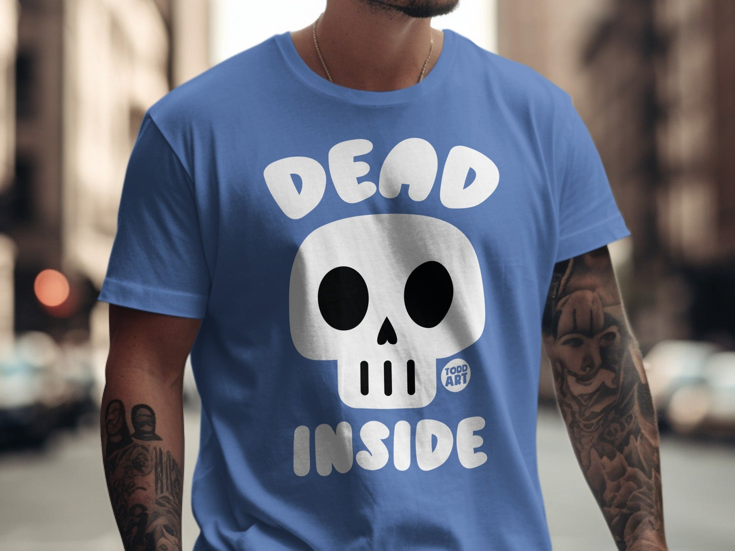Blue t-shirt with white "DEAD INSIDE" text and skull graphic.