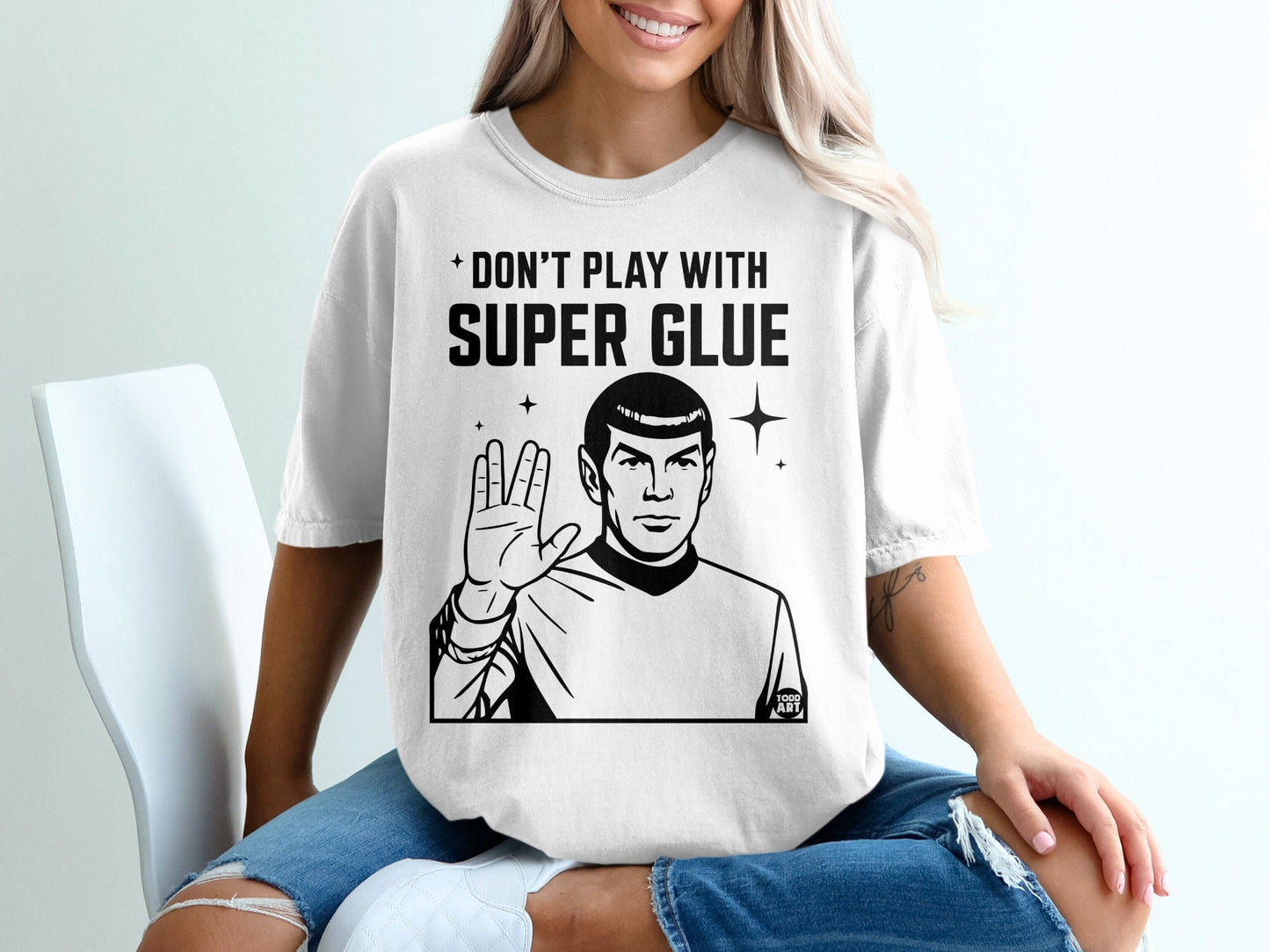 T-shirt with Spock and "Don't play with super glue" text.