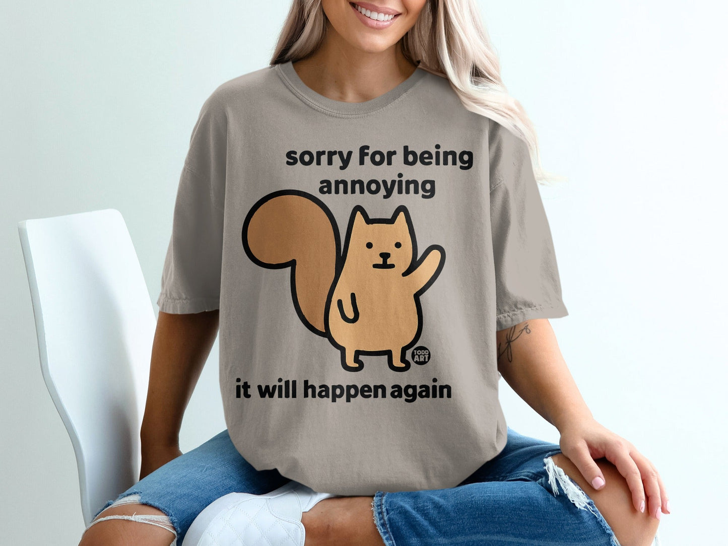 T-shirt with a squirrel graphic and text "sorry for being annoying it will happen again."