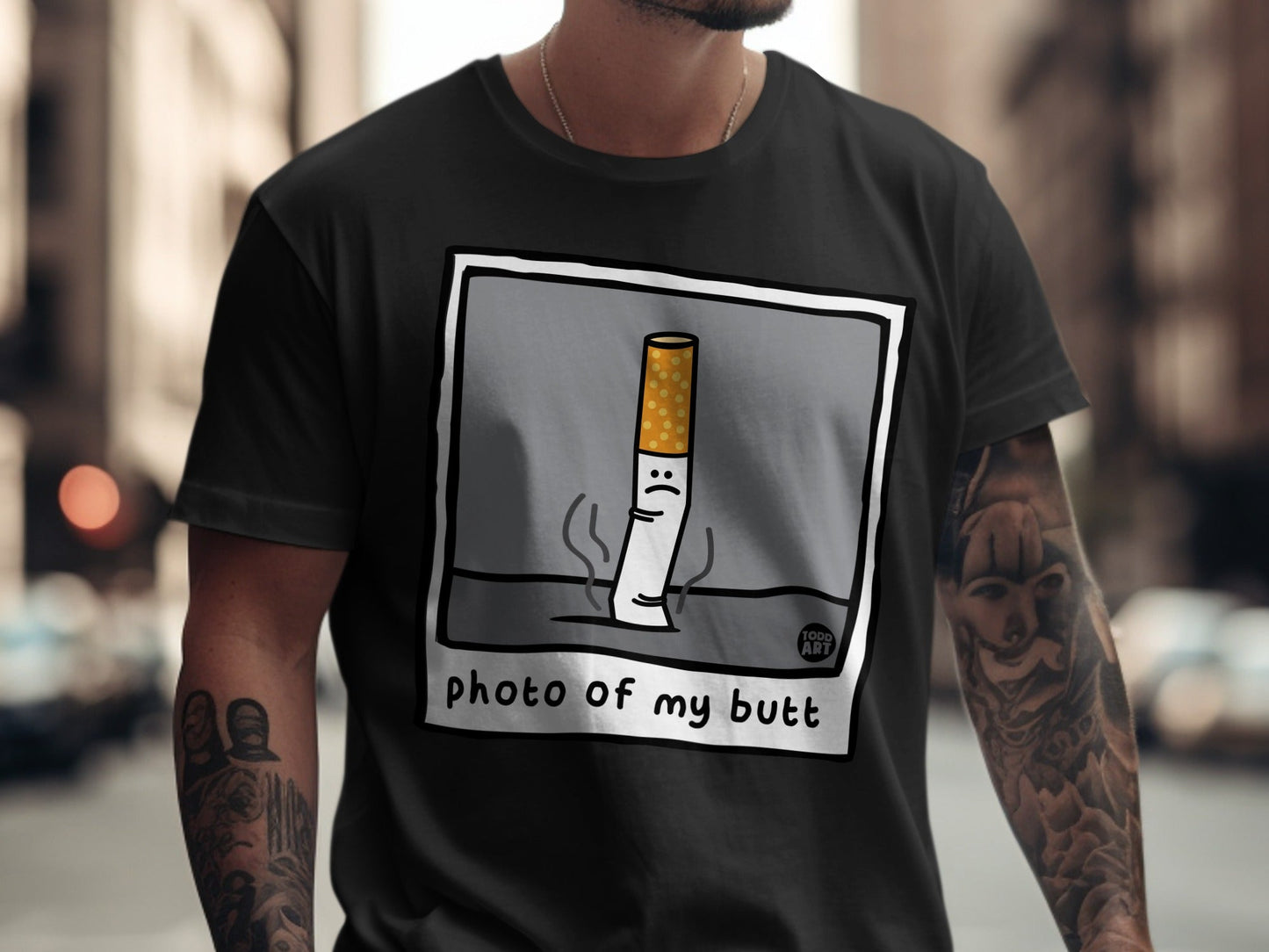 T-shirt graphic of a sad cigarette with the text "photo of my butt".