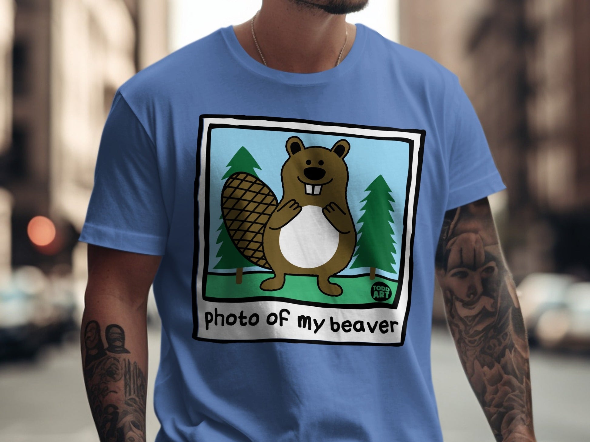 Cartoon beaver wearing a shirt with "photo of my beaver" text and trees.