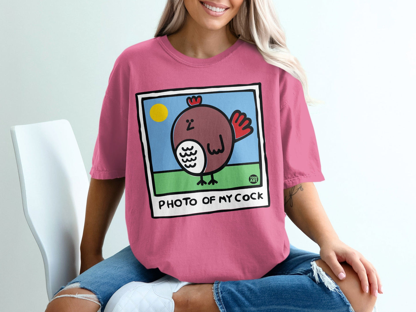 Pink t-shirt with cartoon chicken and text "PHOTO OF MY COCK".
