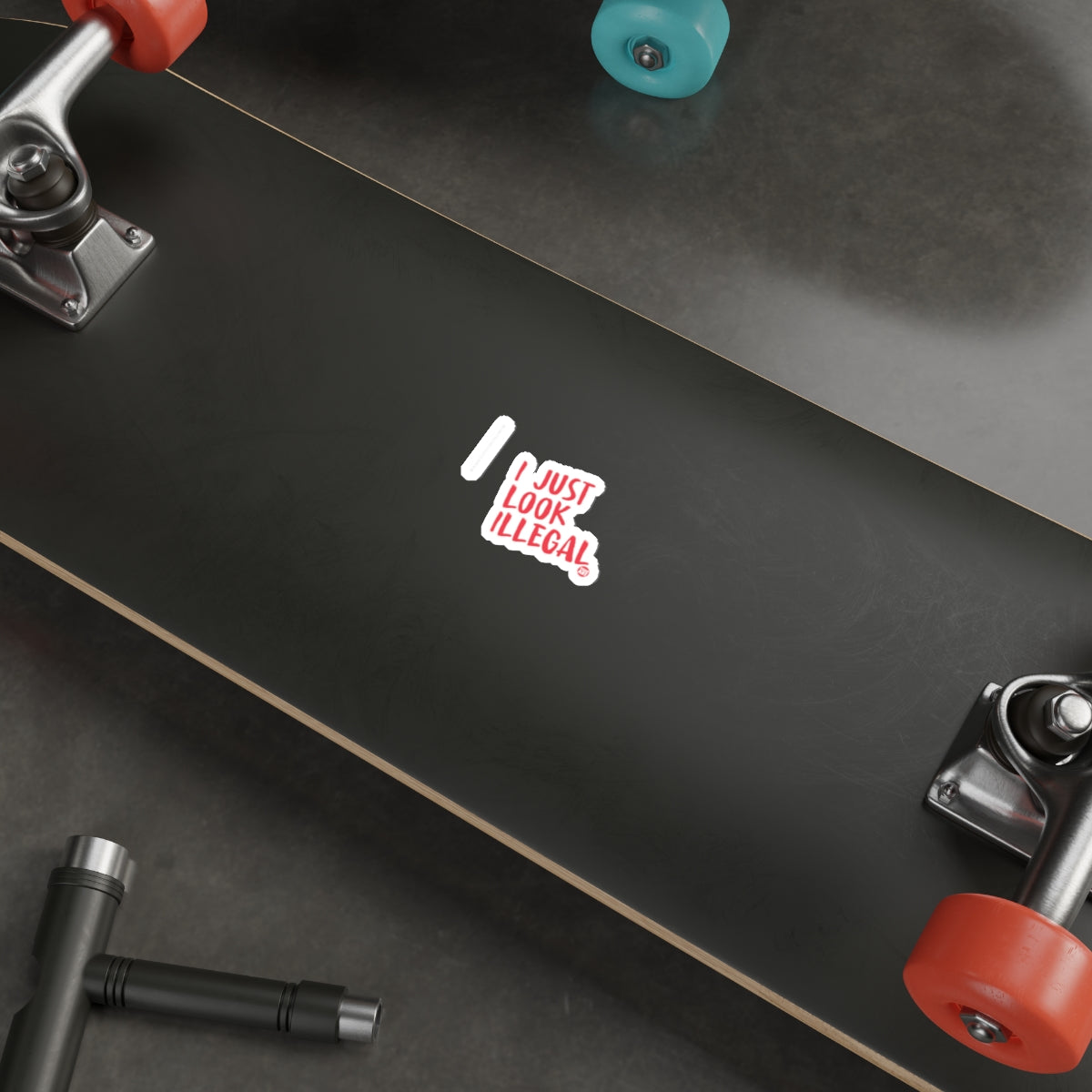 Skateboard with 'I Just Look Illegal' Graphic