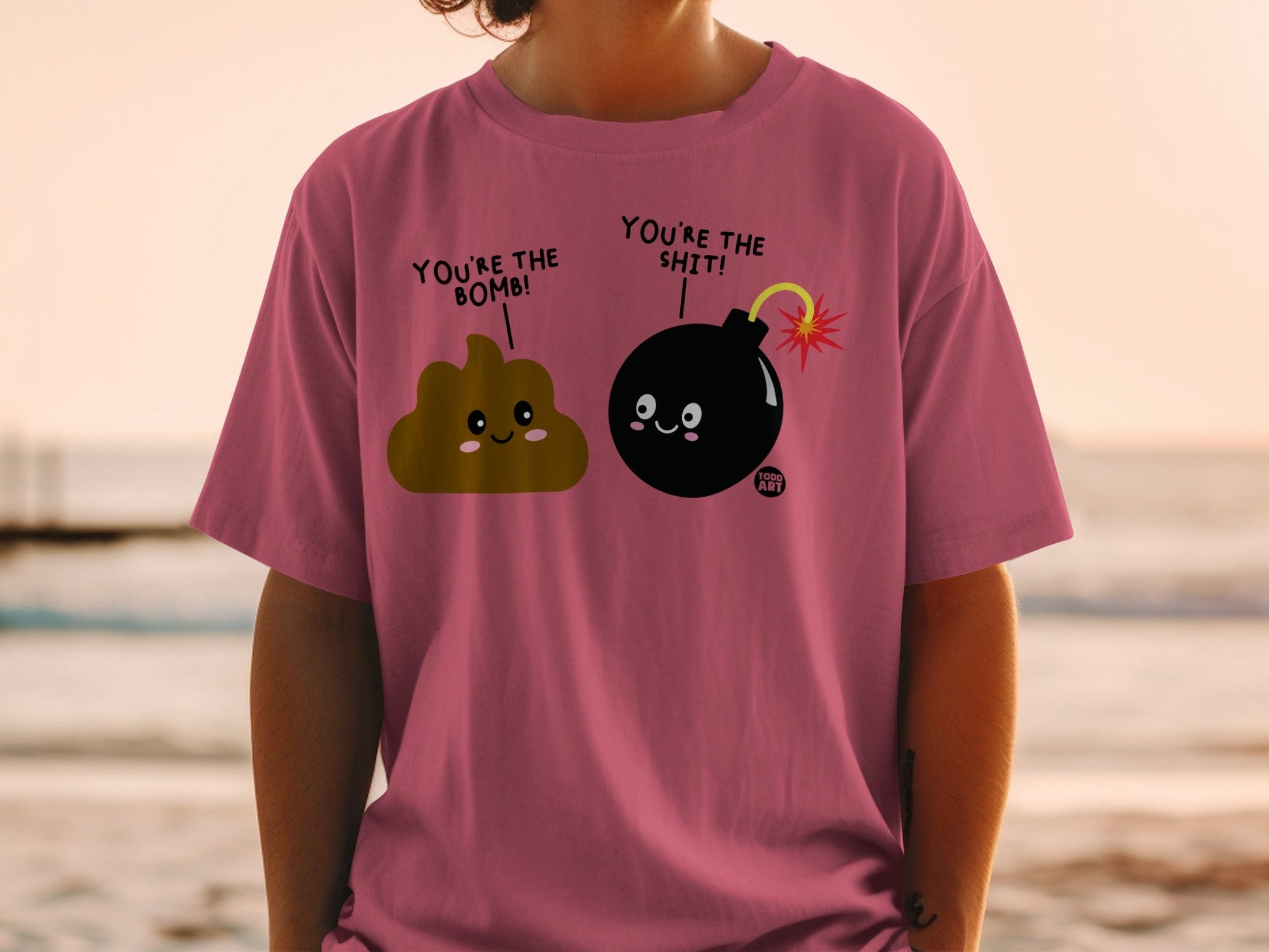 T-shirt with cartoon poop and bomb characters saying "You're the bomb!" and "You're the shit!".