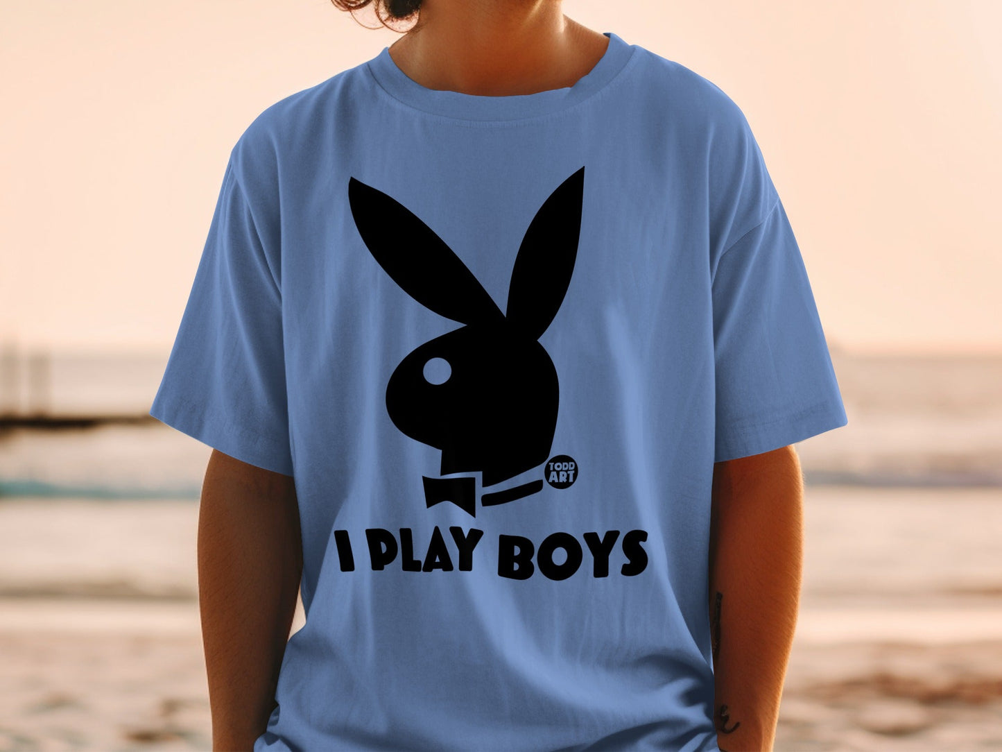 Light blue t-shirt with black Playboy bunny logo and "I PLAY BOYS" text.