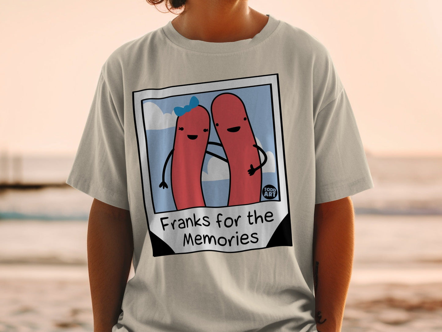 T-shirt with two hot dogs in a photo frame, "Franks for the Memories" text.