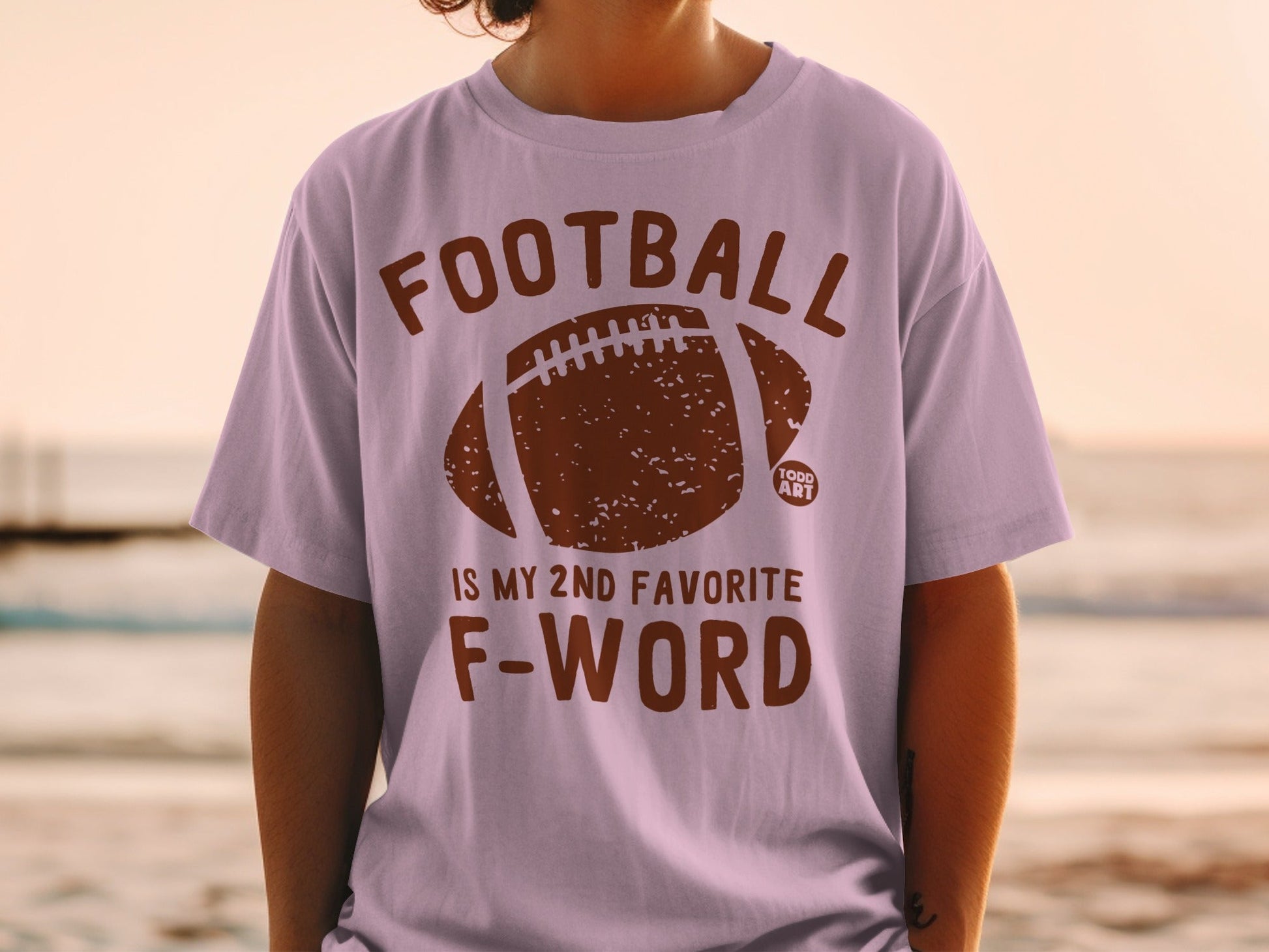Light purple t-shirt with "FOOTBALL IS MY 2ND FAVORITE F-WORD" and football graphic.