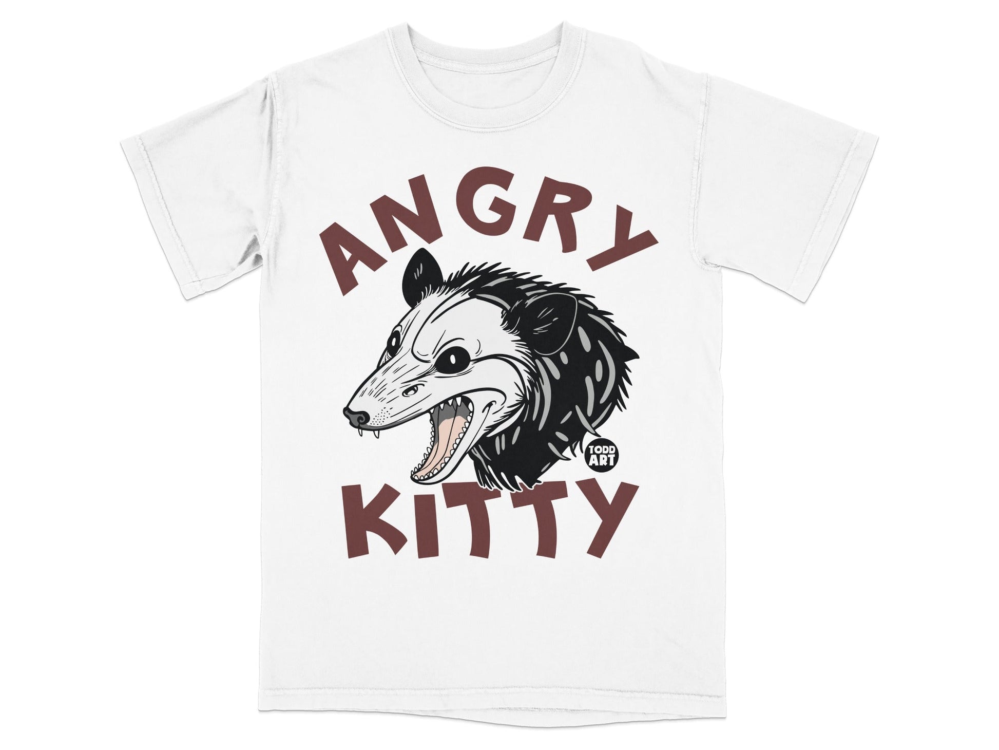 White t-shirt with brown "ANGRY KITTY" text and a cartoon possum head.