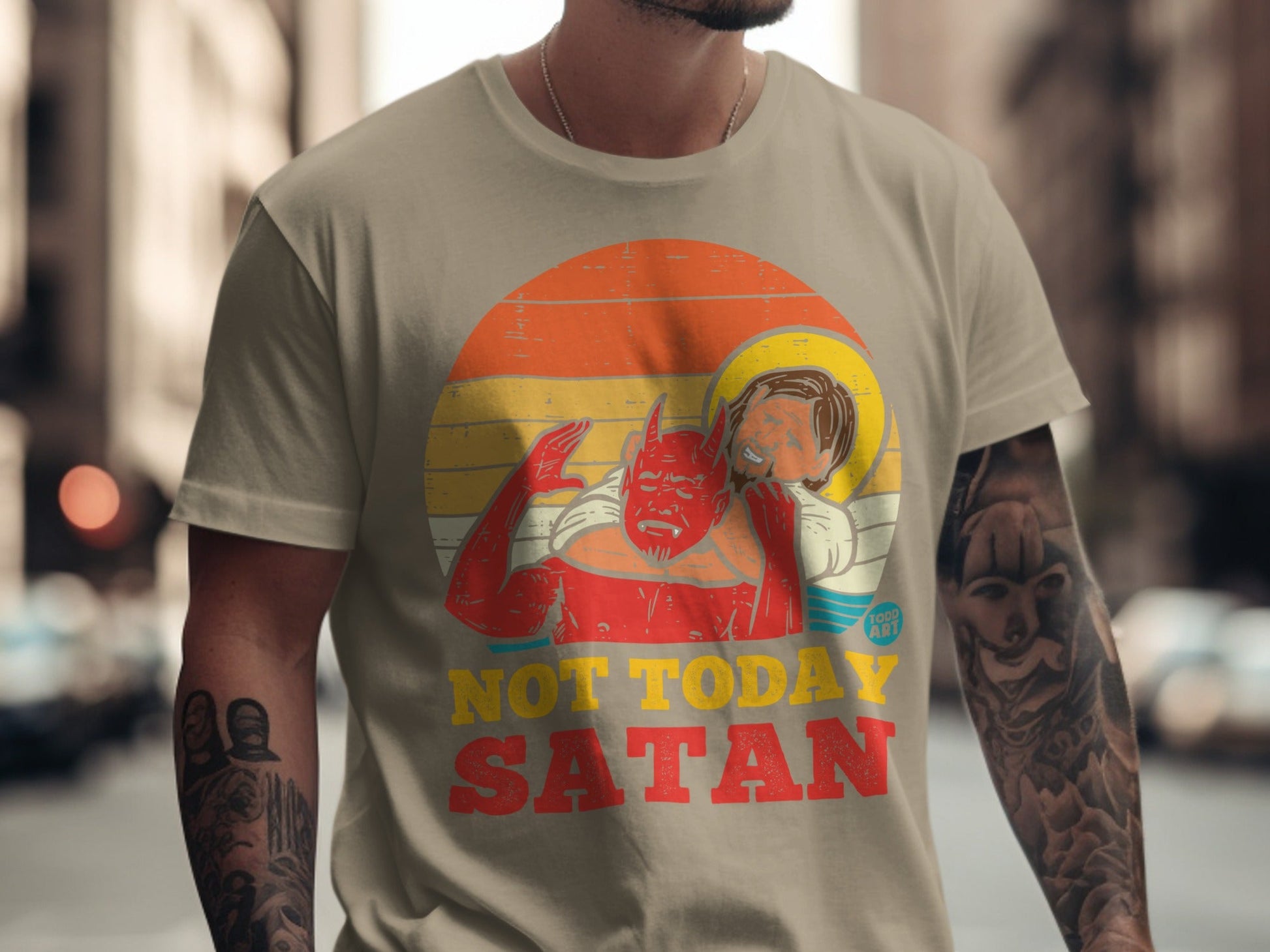 "Not Today Satan" graphic on a t-shirt featuring a cartoon devil and Jesus.