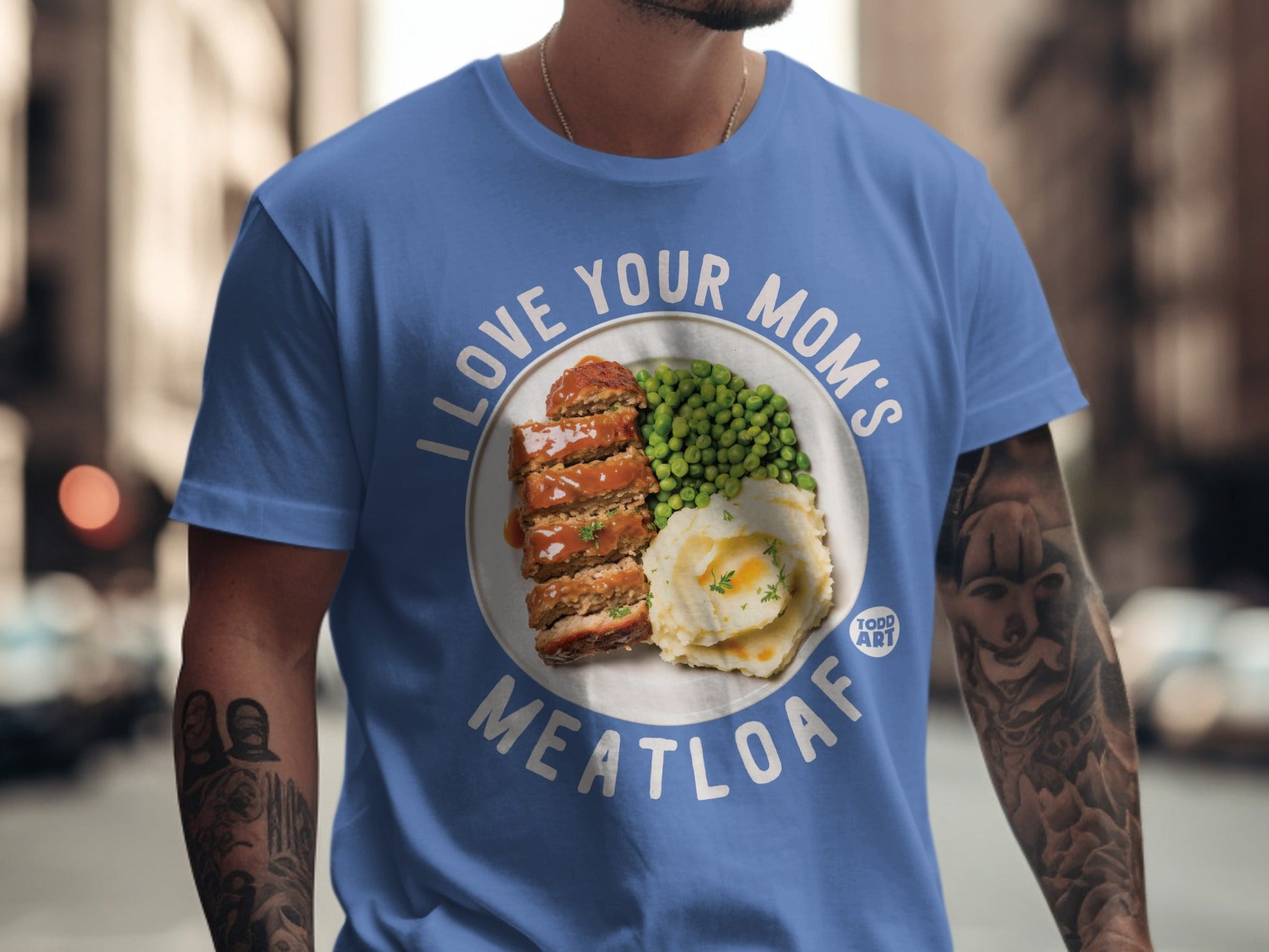 Blue t-shirt with "I LOVE YOUR MOM'S MEATLOAF" and meatloaf with peas.