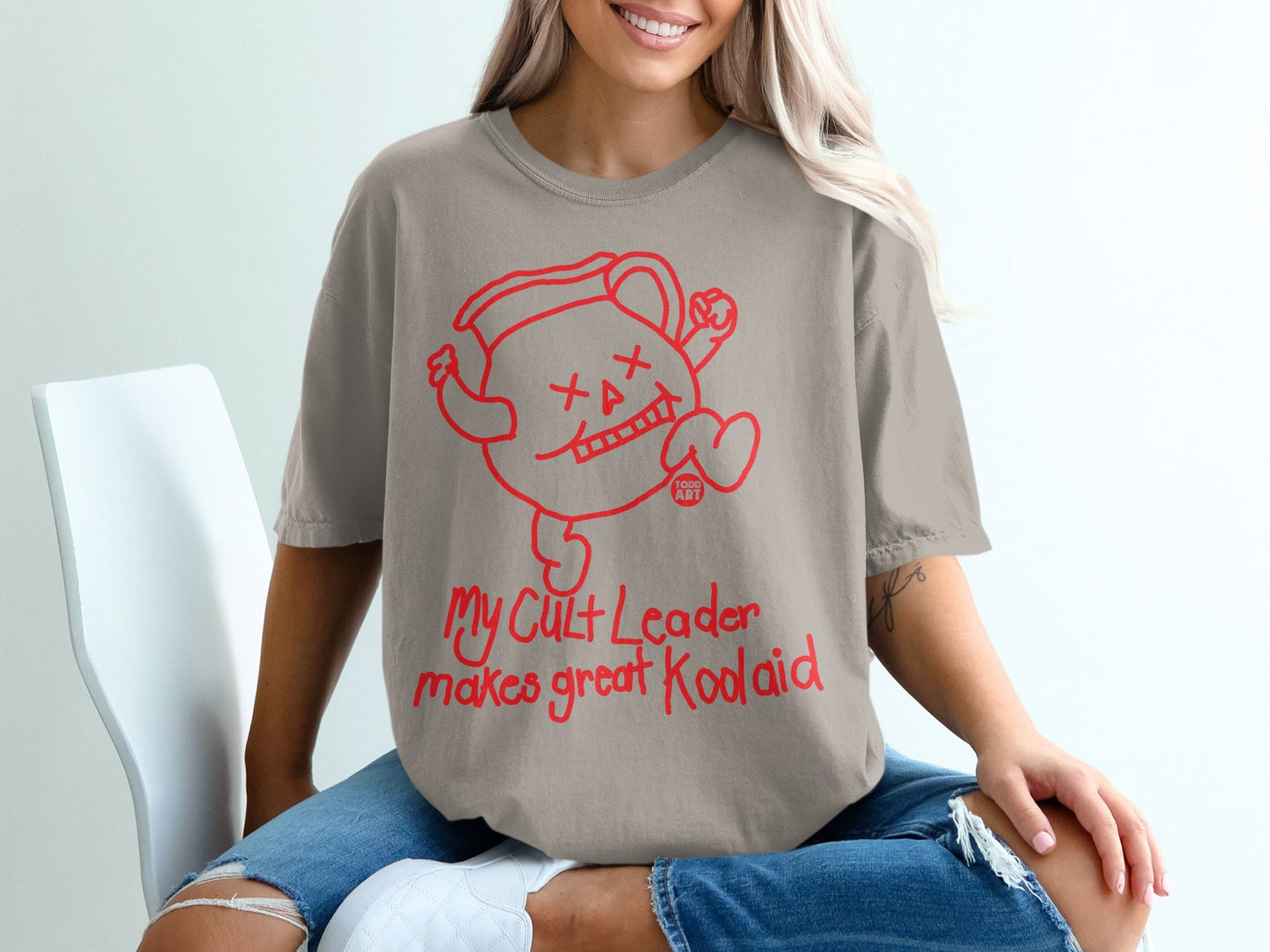 Red graphic of a running Kool-Aid pitcher with text "My Cult Leader makes great Koolaid".