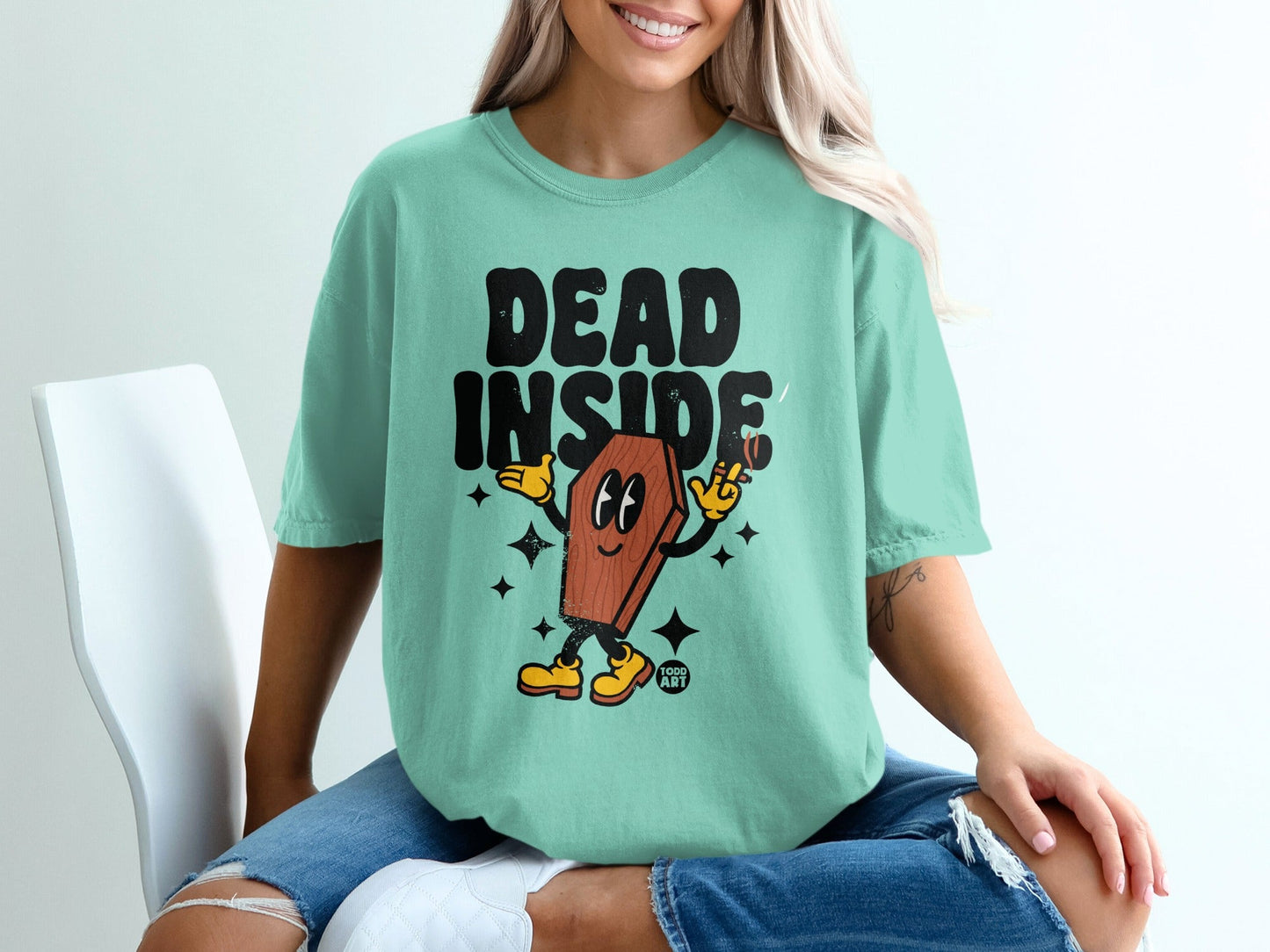 Mint t-shirt with "DEAD INSIDE" text and a cartoon coffin character.