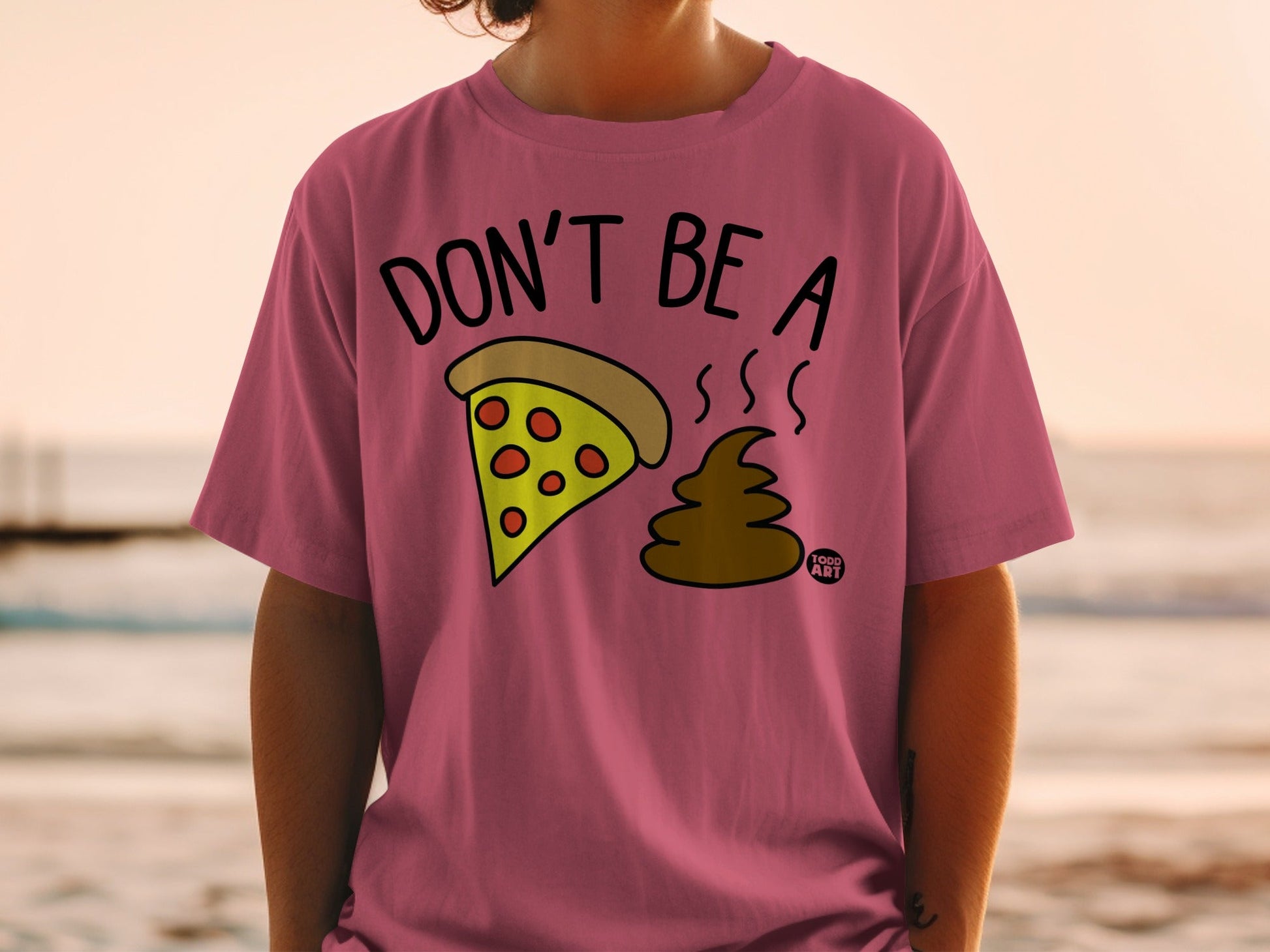 T-shirt with "Don't Be a Piece of Poop" graphic.