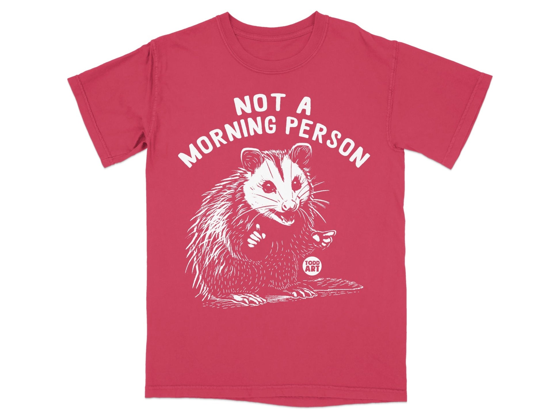 Red t-shirt with a white drawing of an opossum giving a thumbs-up, and text reading "NOT A MORNING PERSON".