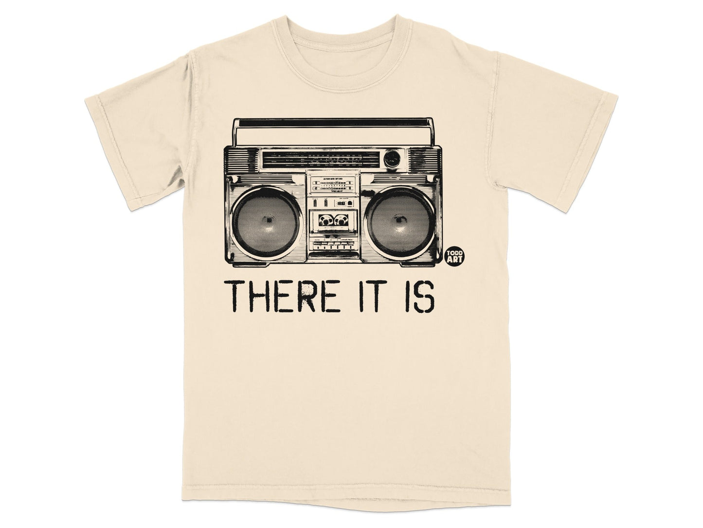 T-shirt graphic: cream boombox with "THERE IT IS" text and small "TOOD ART" logo.