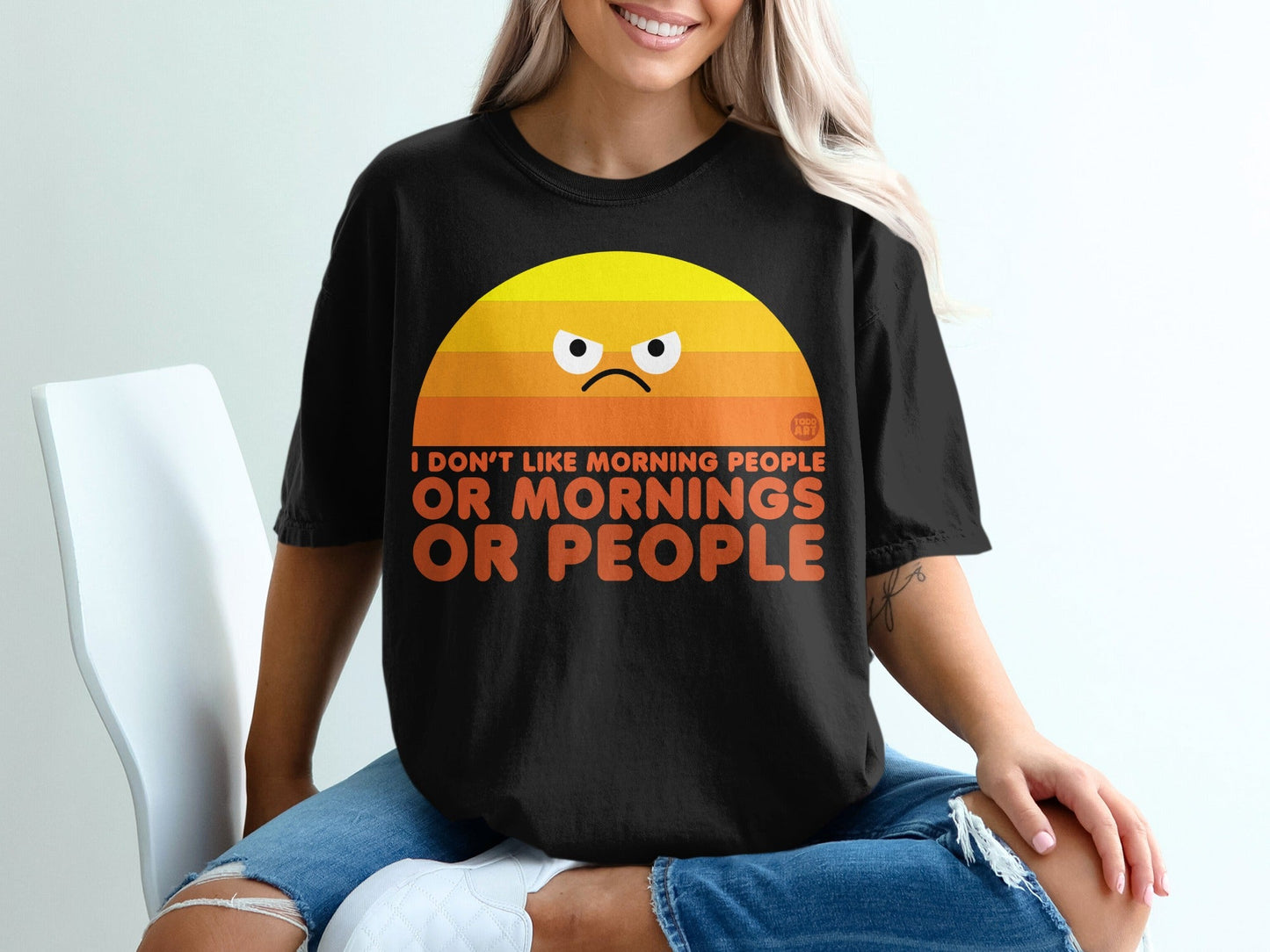 Black t-shirt with grumpy sun graphic and text "I DON'T LIKE MORNING PEOPLE OR MORNINGS".