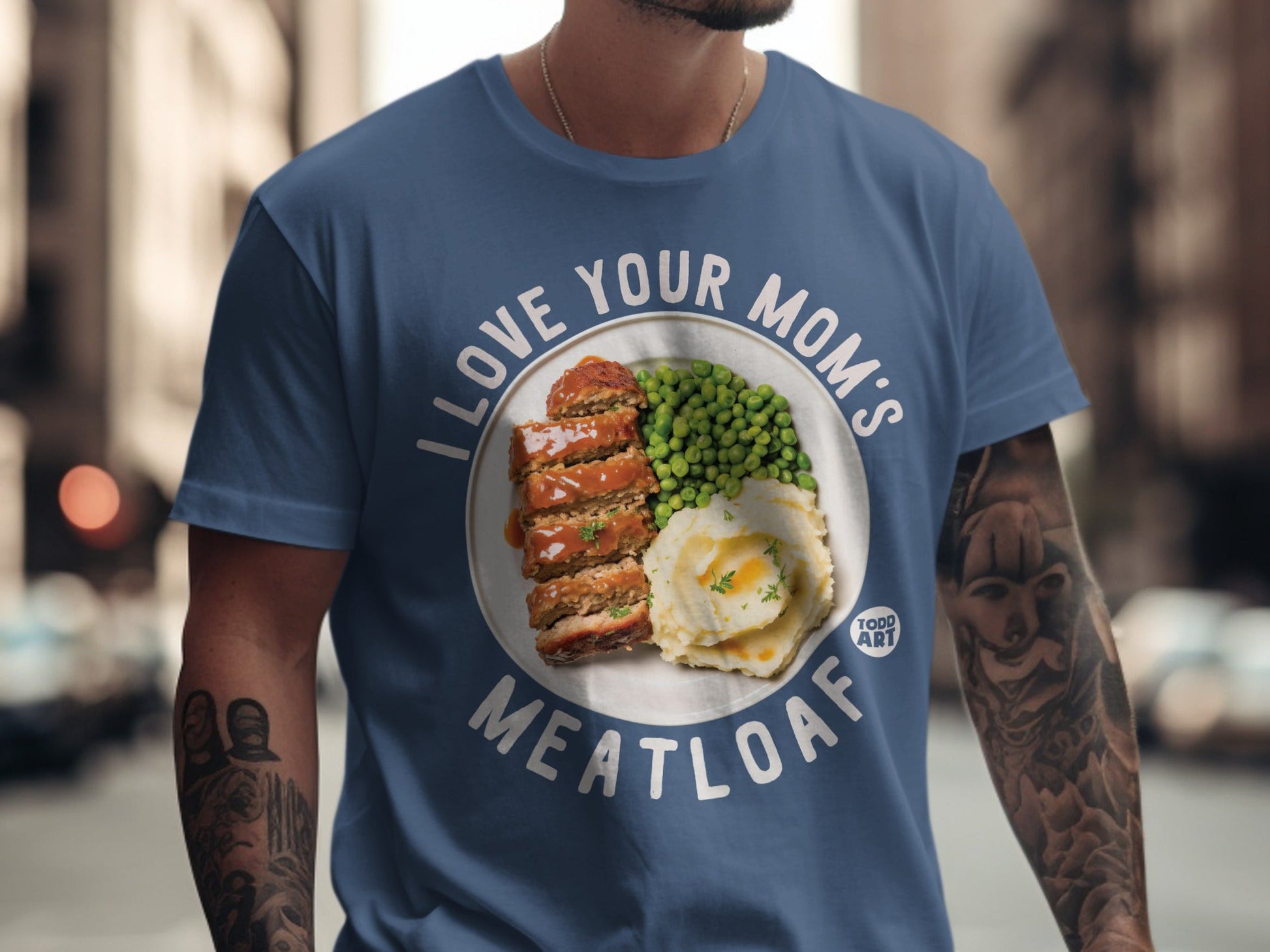 Blue t-shirt with "I LOVE YOUR MOM'S MEATLOAF" and meatloaf with mashed potatoes and peas.