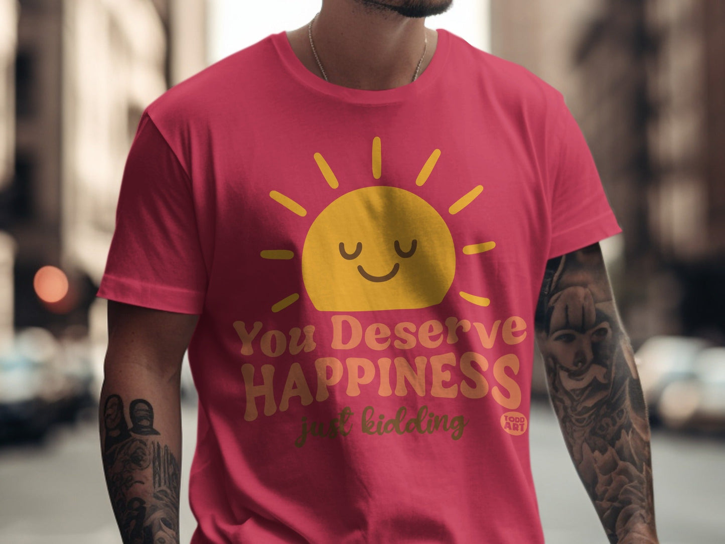 Red t-shirt with yellow sun graphic and text "You Deserve Happiness just kidding".