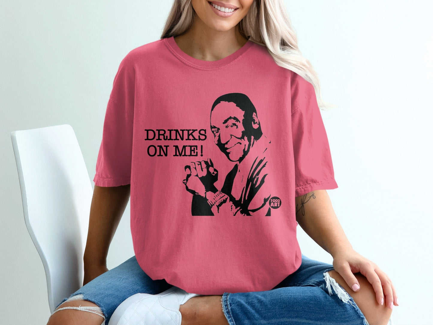 T-shirt with "DRINKS ON ME!" and a caricature of a man.