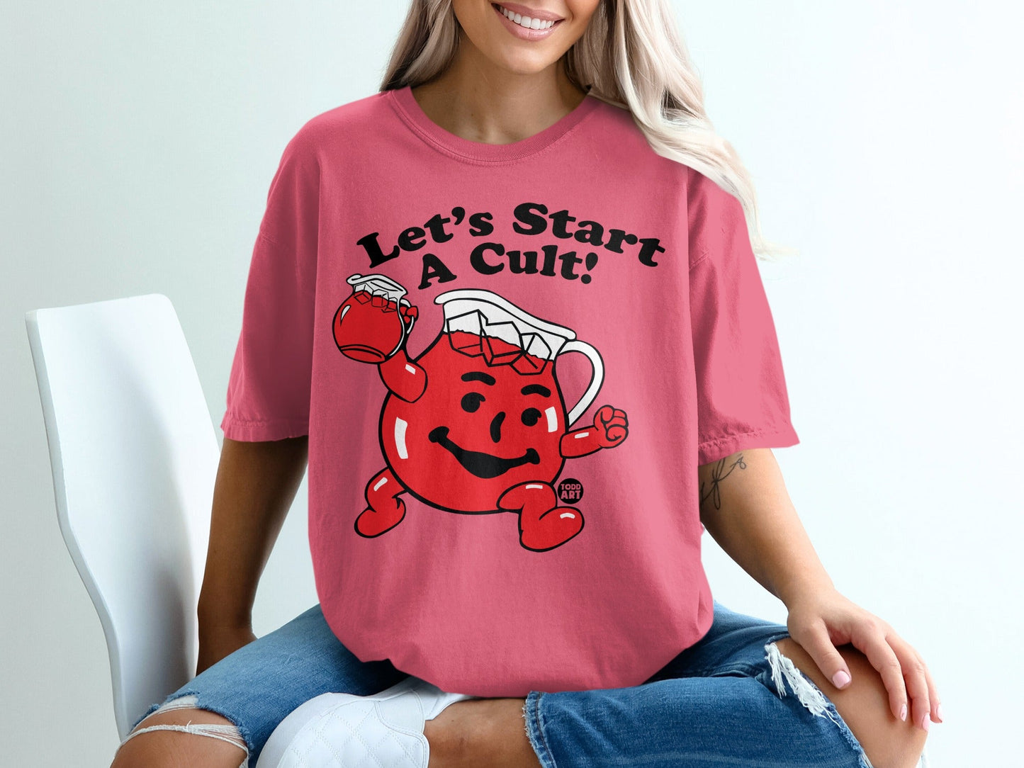 Kool-Aid Man in pink t-shirt, "Let's Start a Cult!" slogan.
